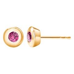 14 Karat Yellow Gold Bezel Set Ruby Stud Earrings Weighing 0.30 Carat