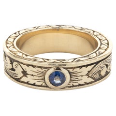 14 Karat Yellow Gold Bezel Set Sapphire Scroll Band