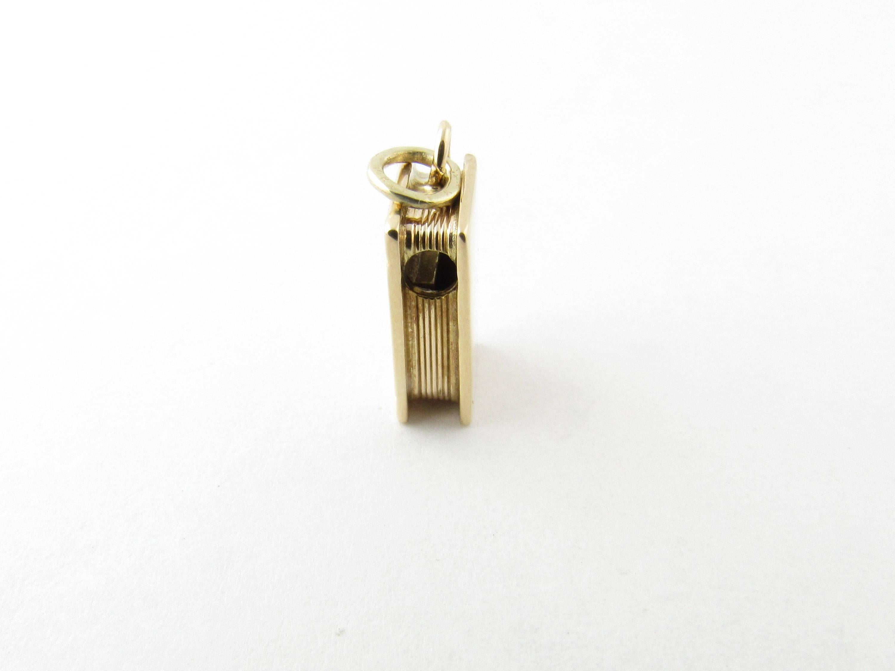 Vintage 14 Karat Yellow Gold Bible Charm-

This lovely 3D charm features a miniature Bible detailed with a lovely cross on its cover.

Can also be worn as a pendant hole through top as shown.

Size:  12 mm x  8mm (actual charm)

Weight:  1.6 dwt. / 