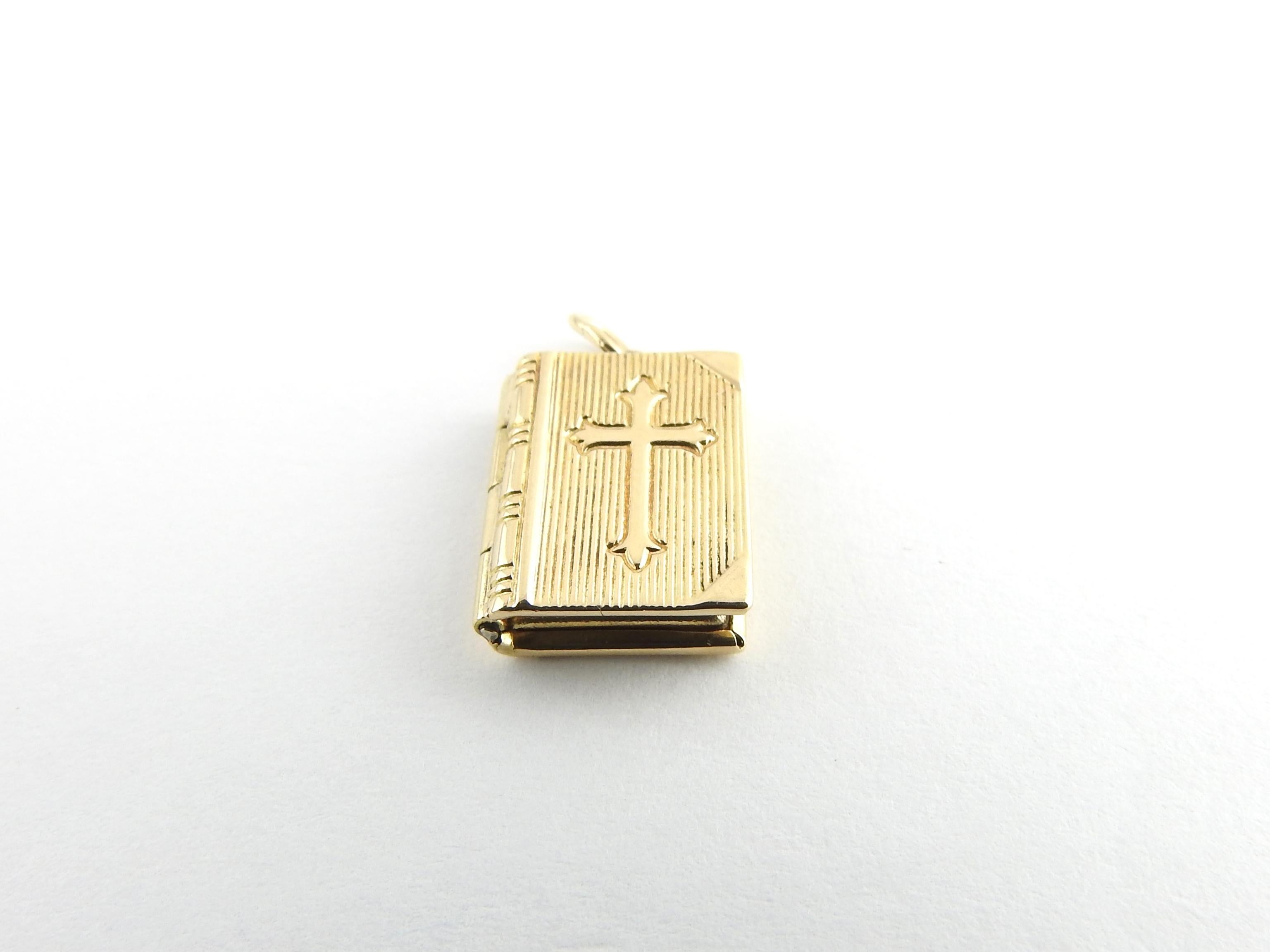 Vintage 14 Karat Yellow Gold Bible Lord's Prayer Charm

This lovely Bible charm features a cross on its cover and opens to reveal The Lord's Prayer. Beautifully detailed in 14K yellow gold.

Size: 14 mm x 11 mm (actual charm)

Weight: 1.4 dwt. / 2.3