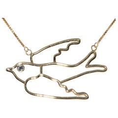 14 Karat Yellow Gold Bird Pendant