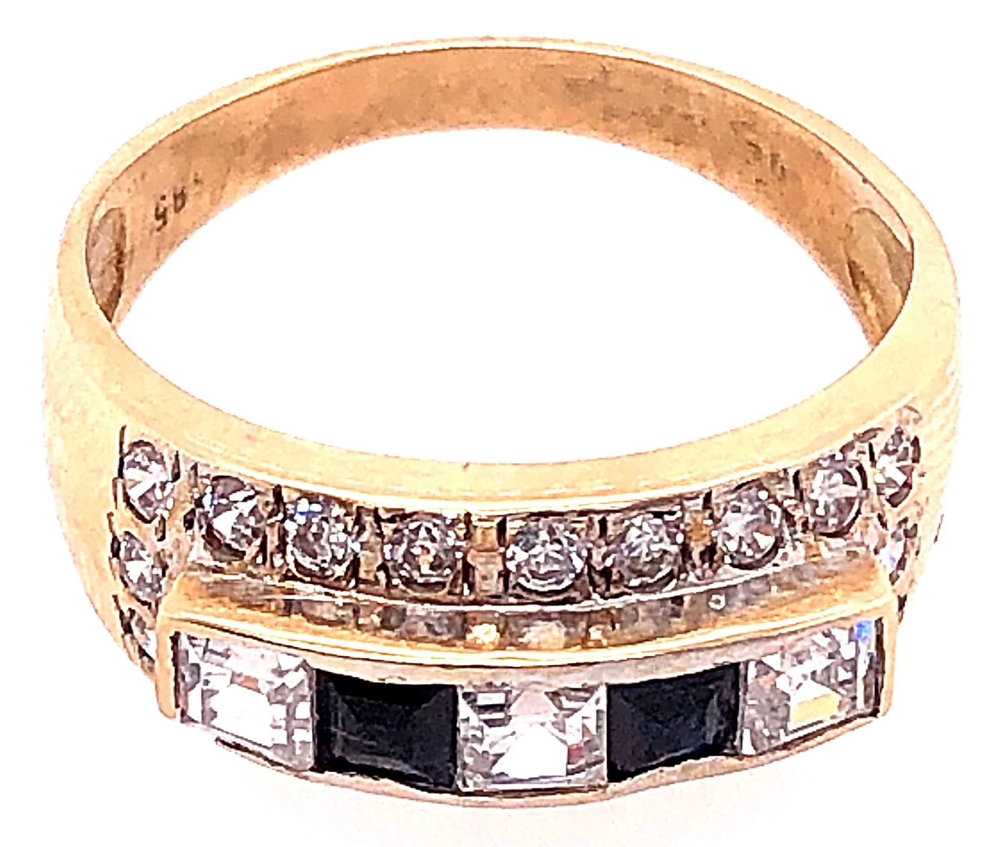 14 Karat Yellow Gold Fashion Ring with Onyx and Round Diamonds.
2 piece square cut onyx
20 piece round diamonds with 1.00 total diamond weight.
3 piece square cut diamond with 0.50 total diamond weight.
Size 7.5
 Height: 9 mm
4.04 grams total