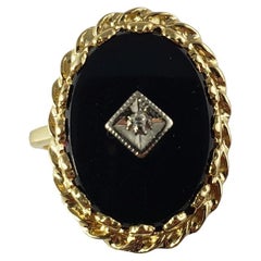 Anello in oro giallo 14 carati con onice nera e diamanti