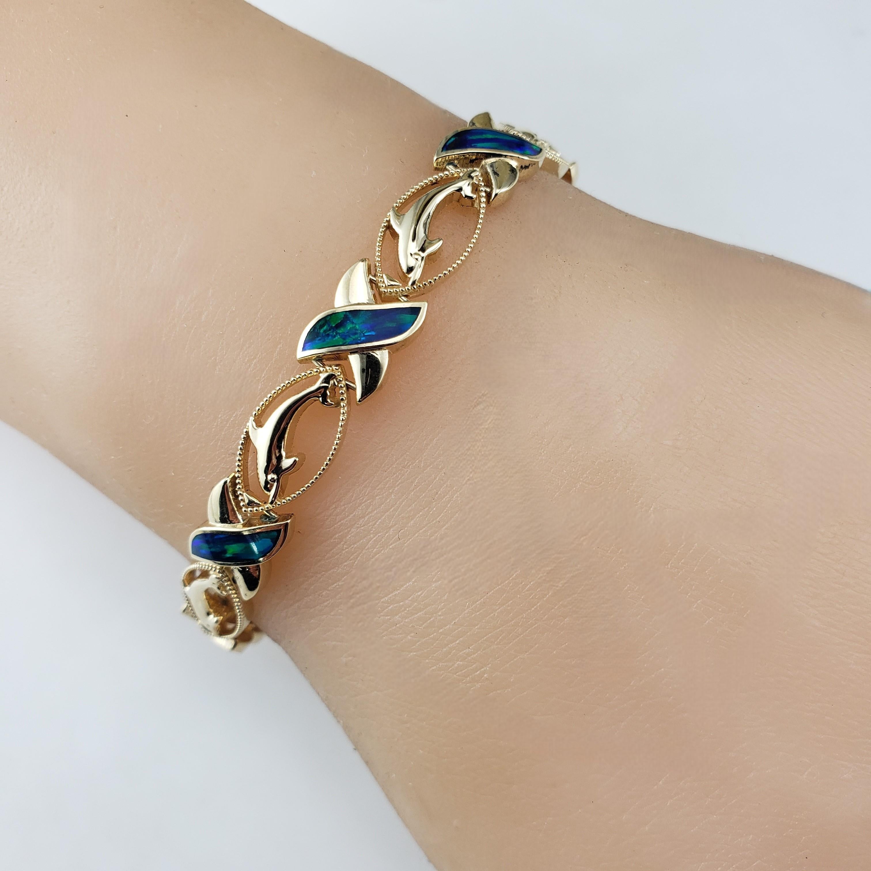 14 Karat Yellow Gold & Black Opal XO Dolphin Bracelet  #18582 For Sale 1