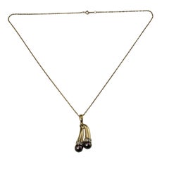 14 Karat Yellow Gold Black Pearl and Diamond Pendant Necklace