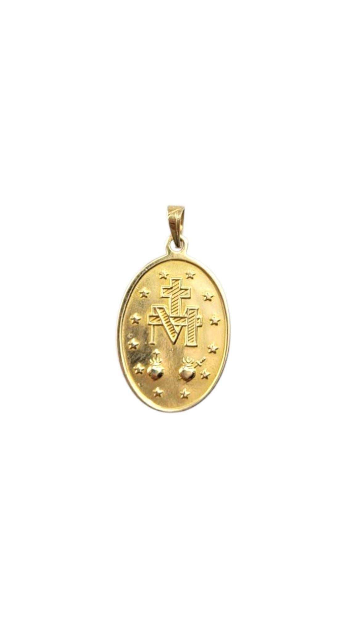 14K Yellow Gold Blessed Mother Miraculous Medal Pendant-

14K Yellow Gold Blessed Mother Miraculous Medal Pendant – This beautifully crafted pendant, made from radiant 14K yellow gold, features a detailed image of the Blessed Mother, symbolizing