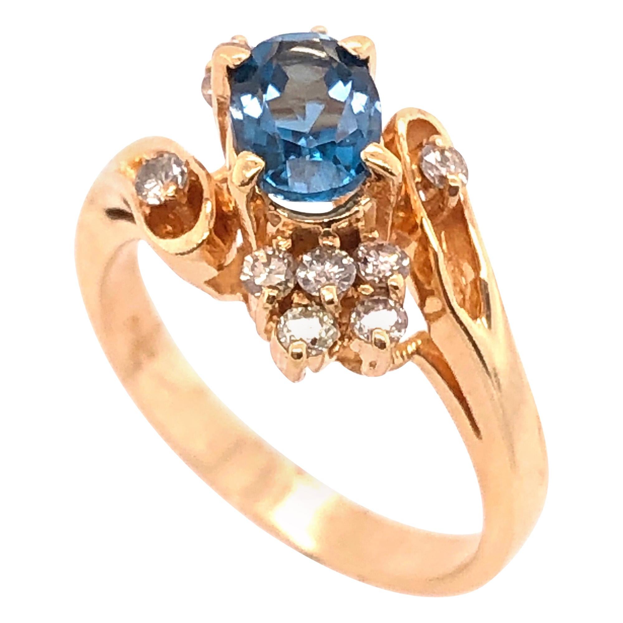 14 Karat Yellow Gold Blue Emerald Ring with Diamond Accents 50.00 TDW For Sale