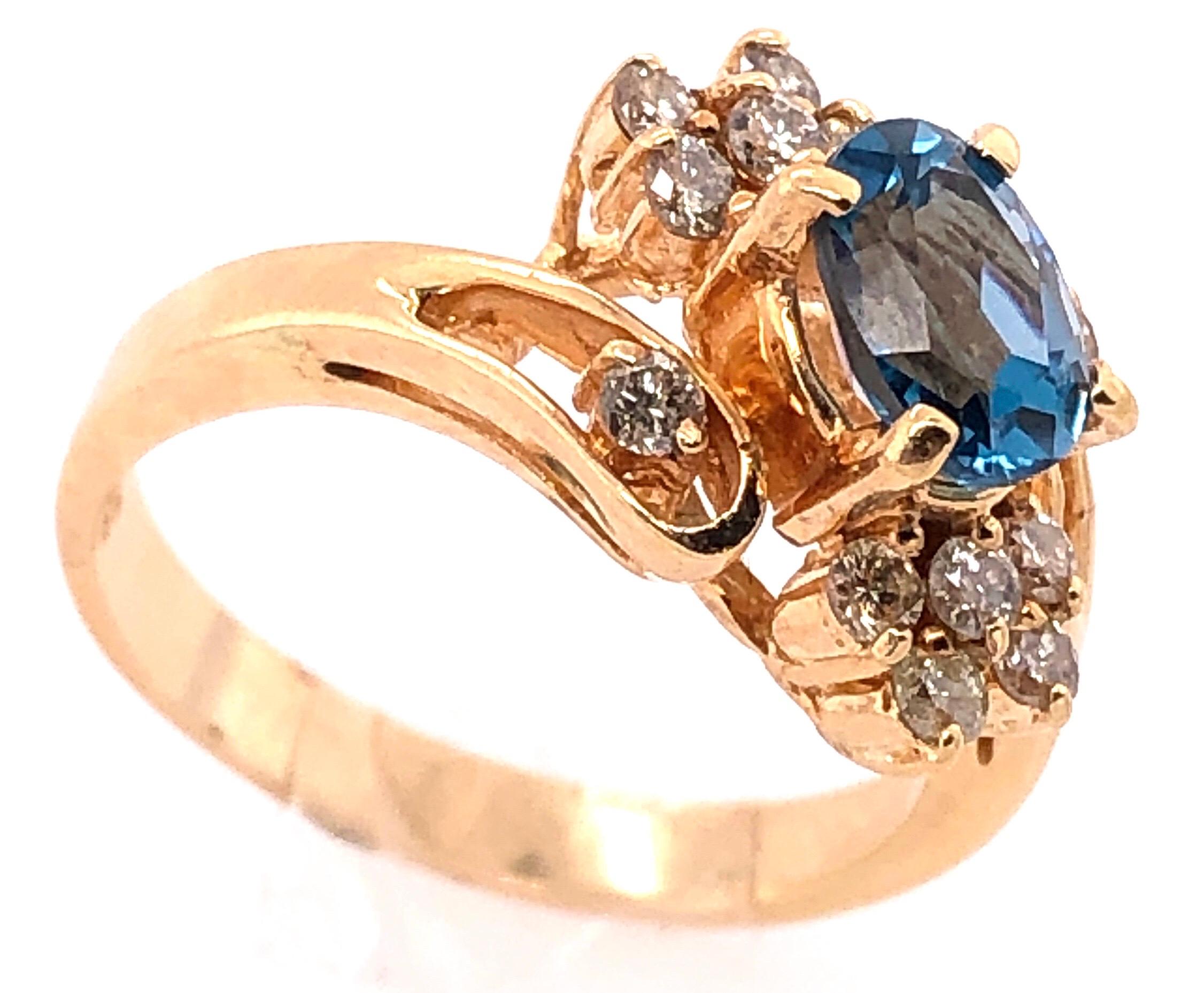 14 Karat Yellow Gold Blue Emerald Ring with Diamond Accents 
50.00 TDW.
Size 6.5
4.22 grams total weight.