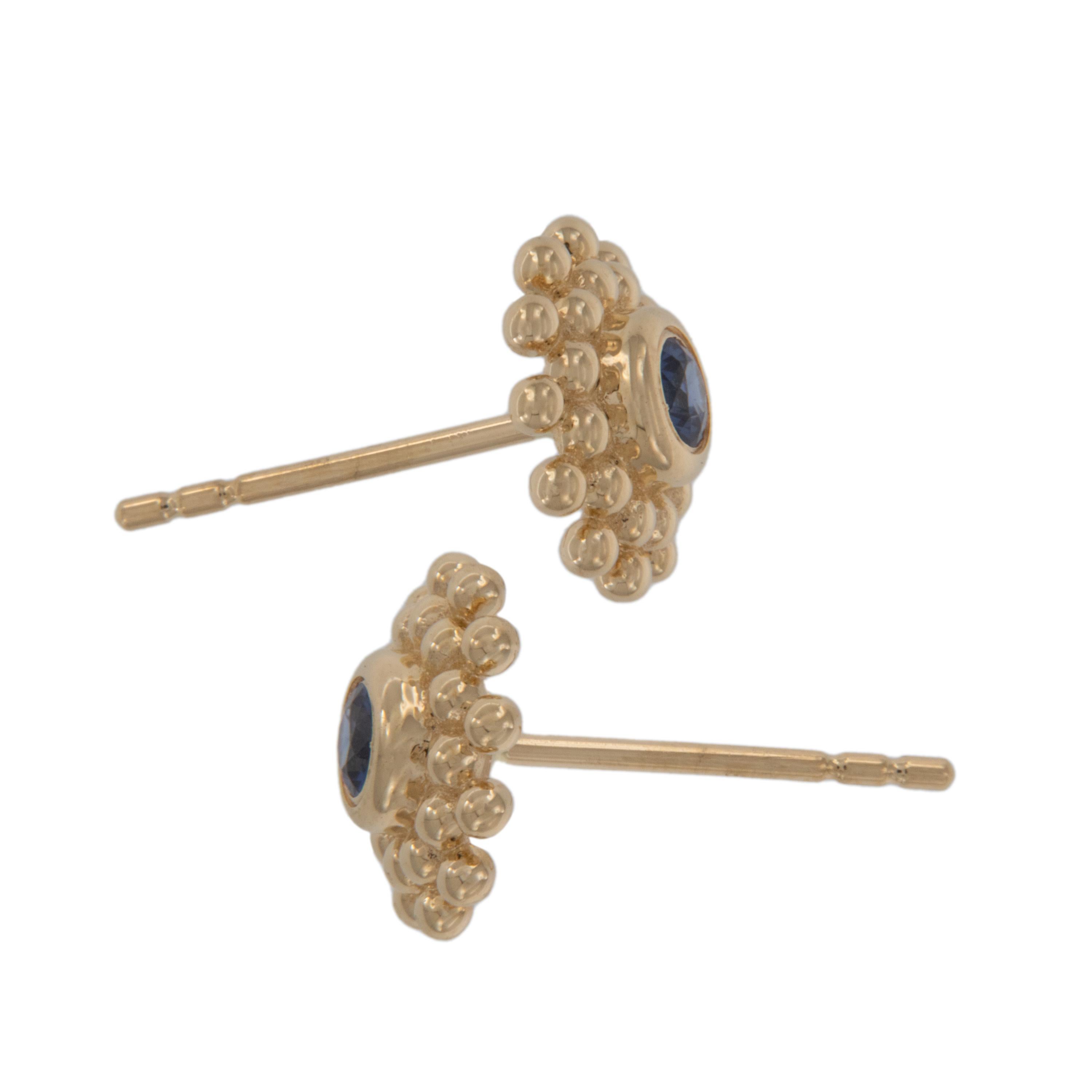 Crafted in pretty 14 karat yellow gold, these beautifully colored sapphires are a hue that is sought after by collectors the world over. These stud earrings are 