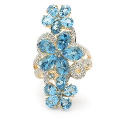14 Karat Yellow Gold Blue Topaz and Diamond Flower Long Finger Ring