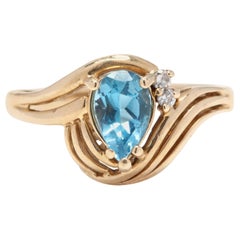 14 Karat Yellow Gold, Blue Topaz and Diamond Ring