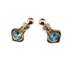 14 Karat Yellow Gold Blue Topaz Dangle Doorknocker Earrings #19058