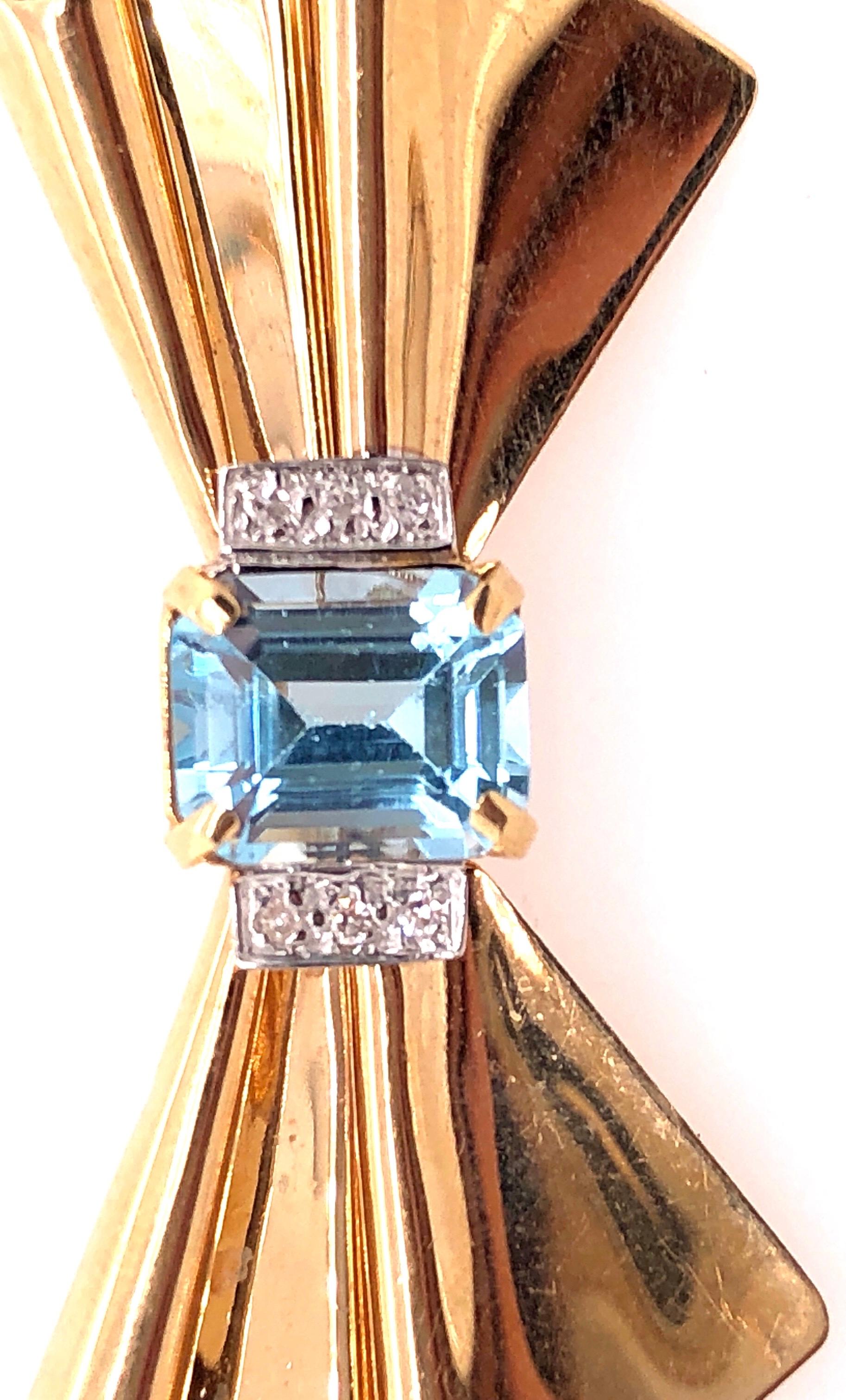 14 Karat Yellow Gold Bow Brooch with Blue Topaz and Diamond Accents In Good Condition For Sale In Stamford, CT