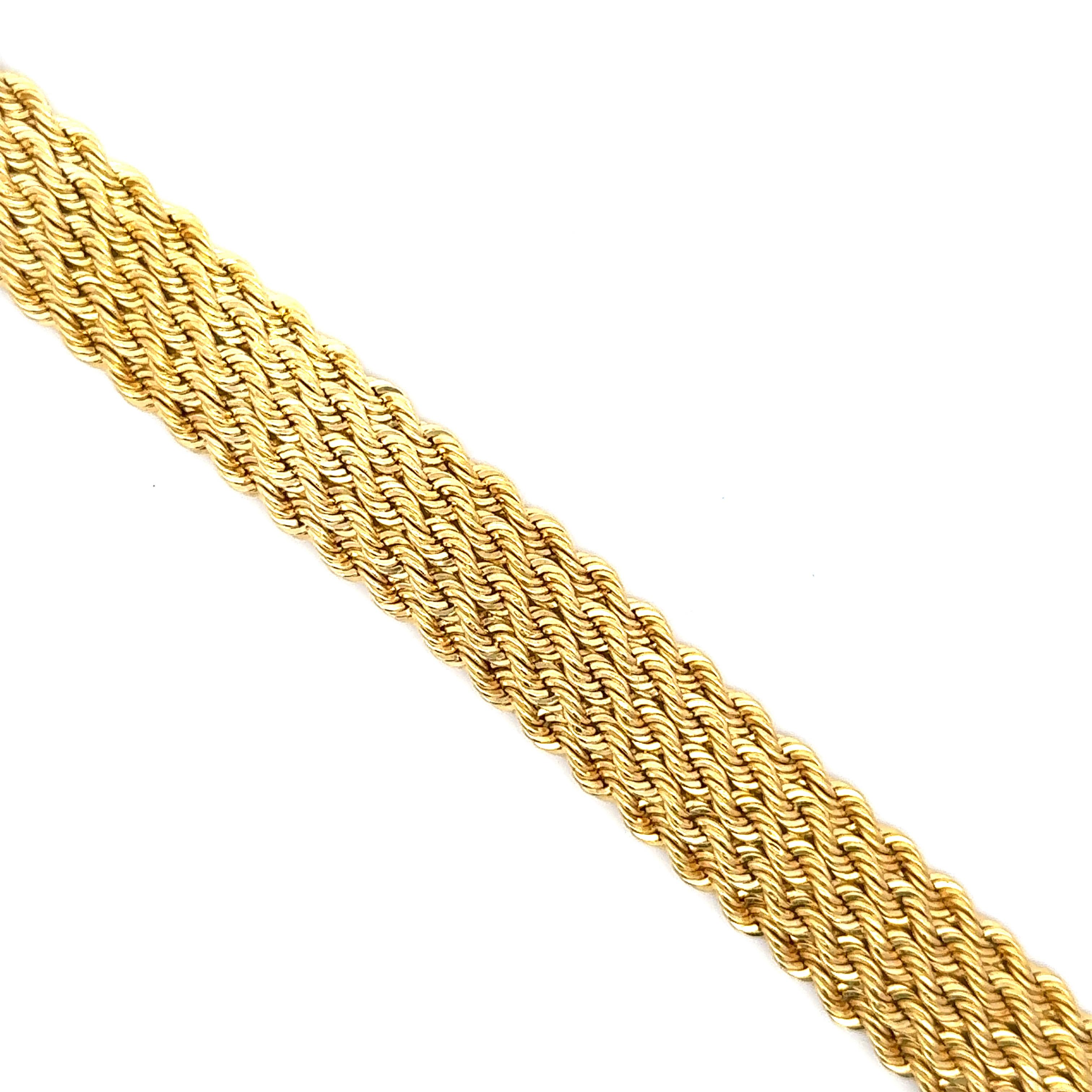 14 Karat Yellow Gold bracelet featuring a braided twist motif weighing 21.1 grams. 
More link bracelets in stock
Search Harbor Diamonds