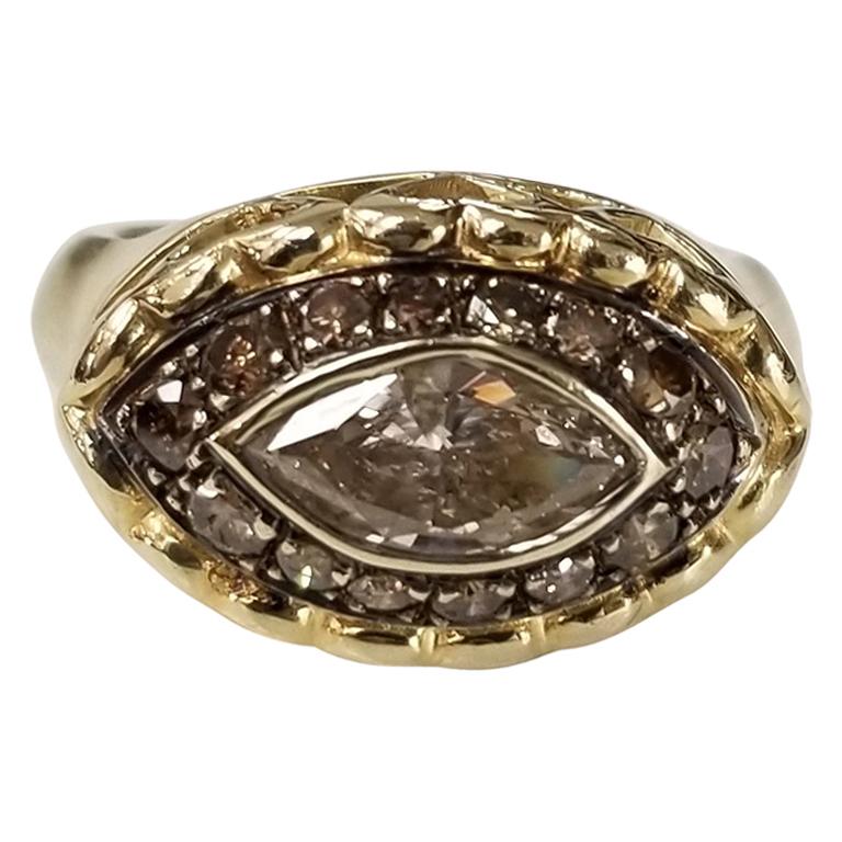 14 Karat Yellow Gold Brown Diamond Halo Ring Containing 1 Marquise Cut Diamond For Sale