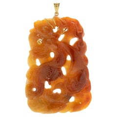 14 Karat Yellow Gold Brownish Red Carved Jade Pendant