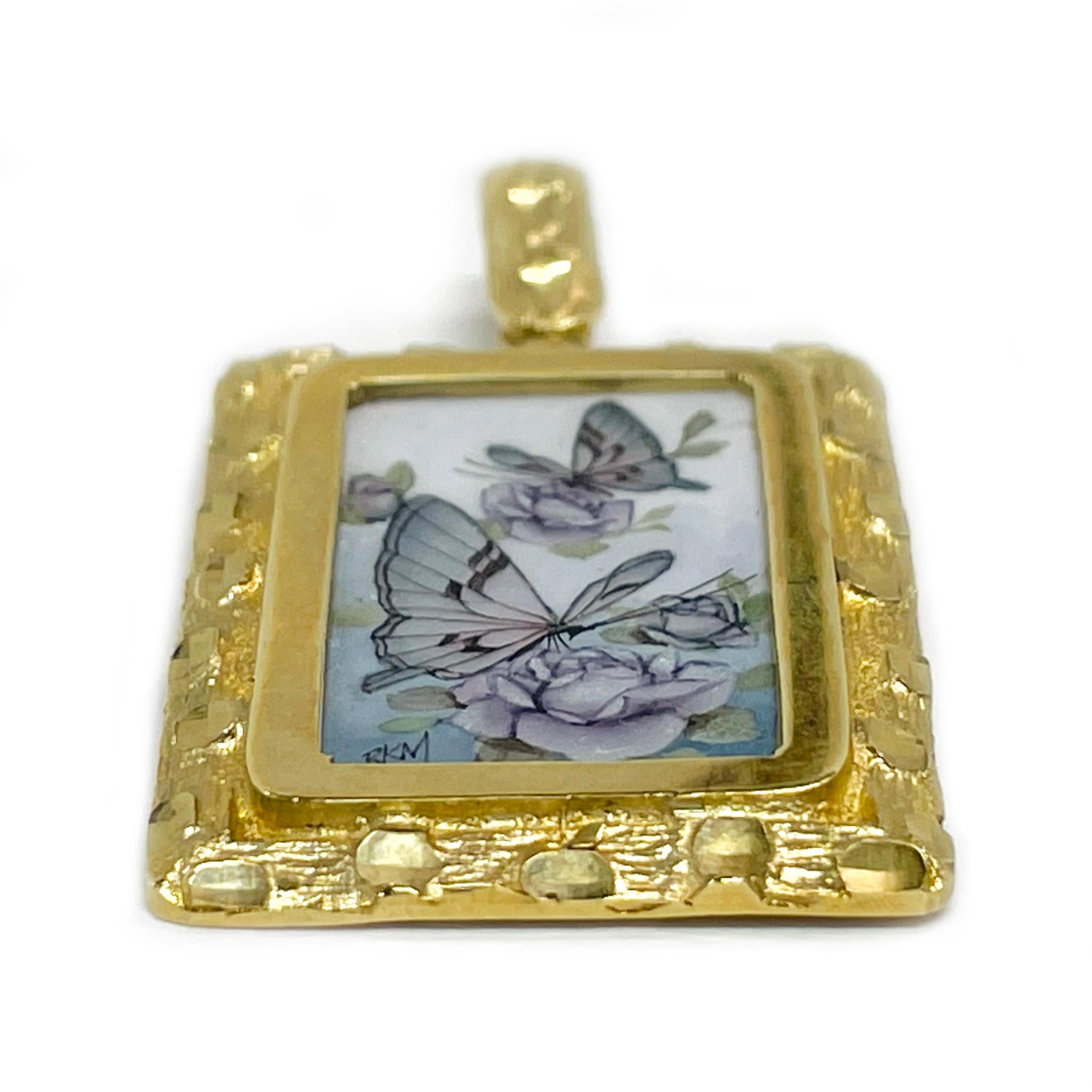 14 Karat Yellow Gold Hand Painted Butterflies and Roses on Mother of Pearl Pendant. Absolutely lovely butterflies and blue lavender roses painting. The miniature painting is set in a 14 karat gold rectangular frame with diamond-cut details. The