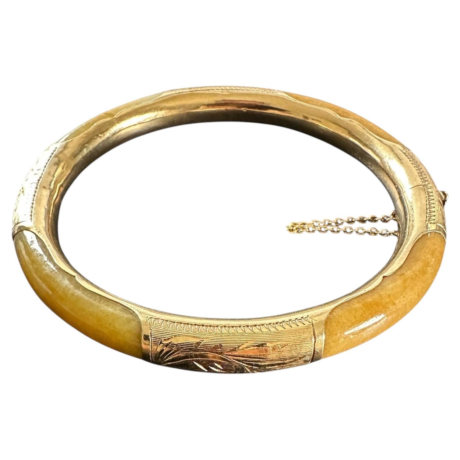 14 karat yellow gold butterscotch colored 7.40 mm Jadeite bangle bracelet