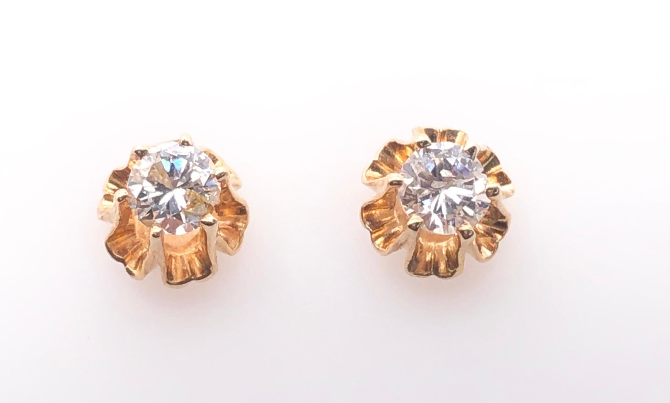 14 Karat Yellow Gold Button Diamond Earrings.
0.50 total diamond weight.
1.3 grams total weight.