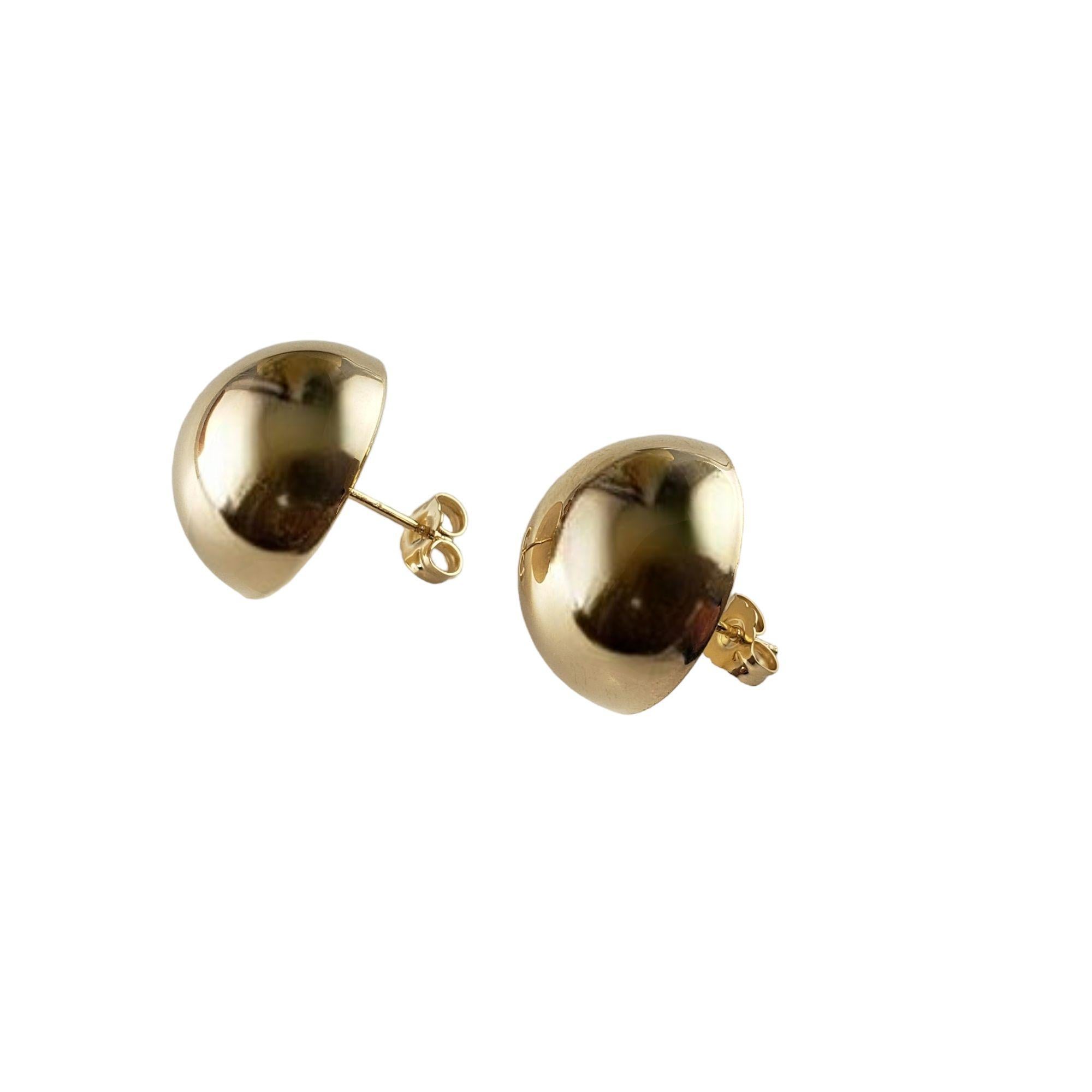 These elegant button earrings are crafted in meticulously detailed 14K yellow gold.  Push back closures.

Size:  18 mm

Weight:  4.3 gr./  2.7 dwt.

Stamped:  585  14K

Very good condition, professionally polished.

Will come packaged in a gift box