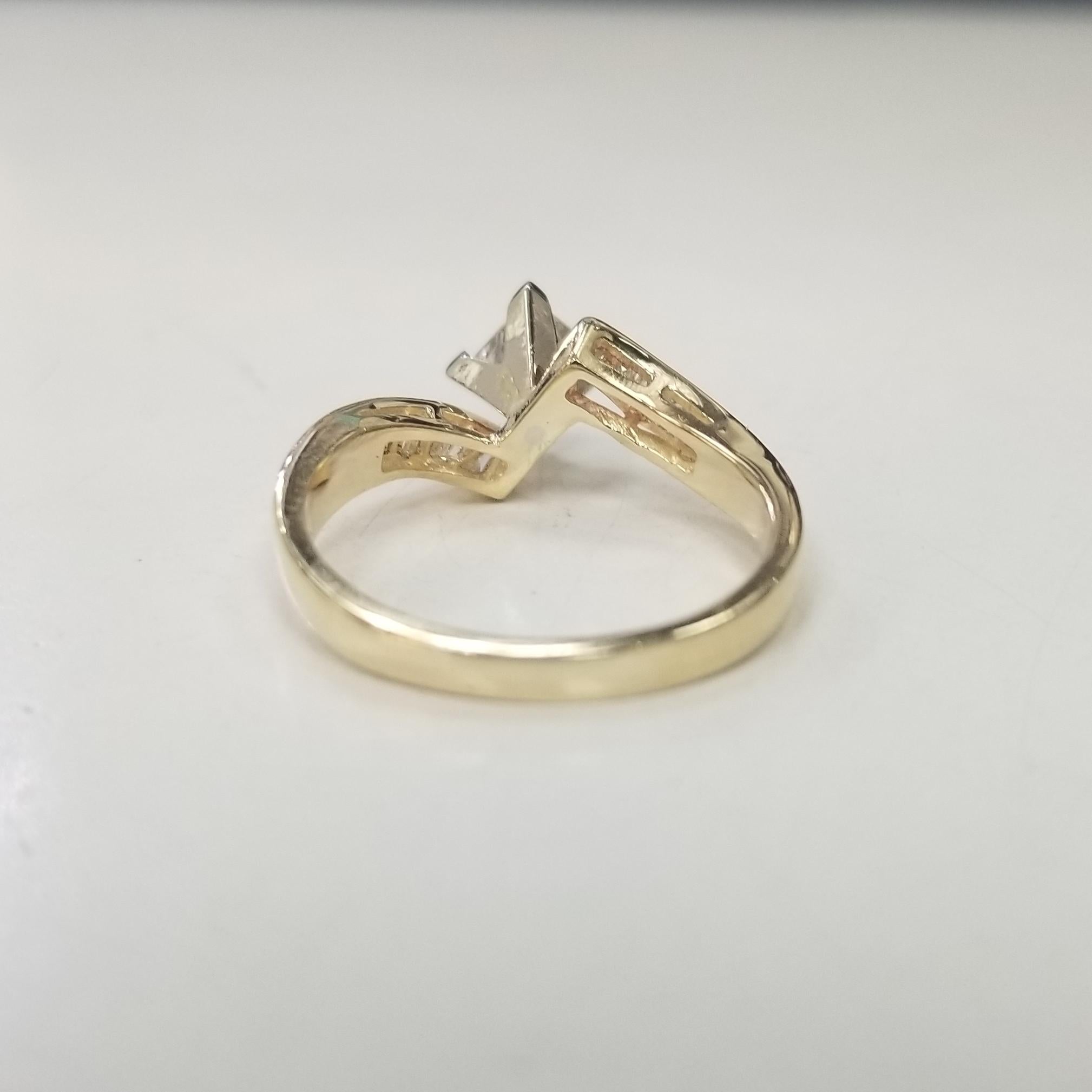 Contemporary 14 Karat Yellow Gold Bypass Baguette and Round Diamond Engagement Ring For Sale
