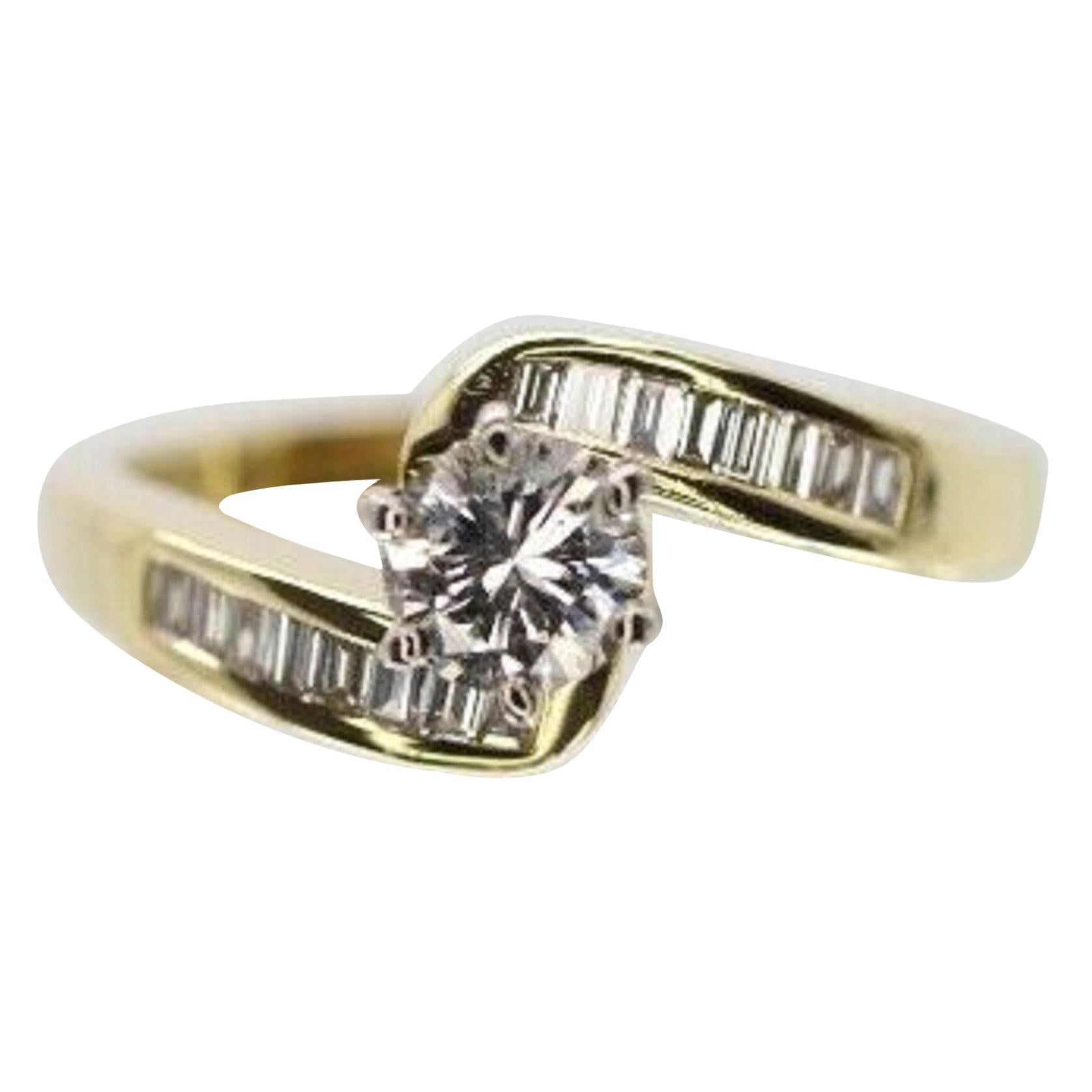 https://a.1stdibscdn.com/14-karat-yellow-gold-bypass-baguette-and-round-diamond-engagement-ring-for-sale/1121189/j_84239621577346170766/8423962_master.jpg