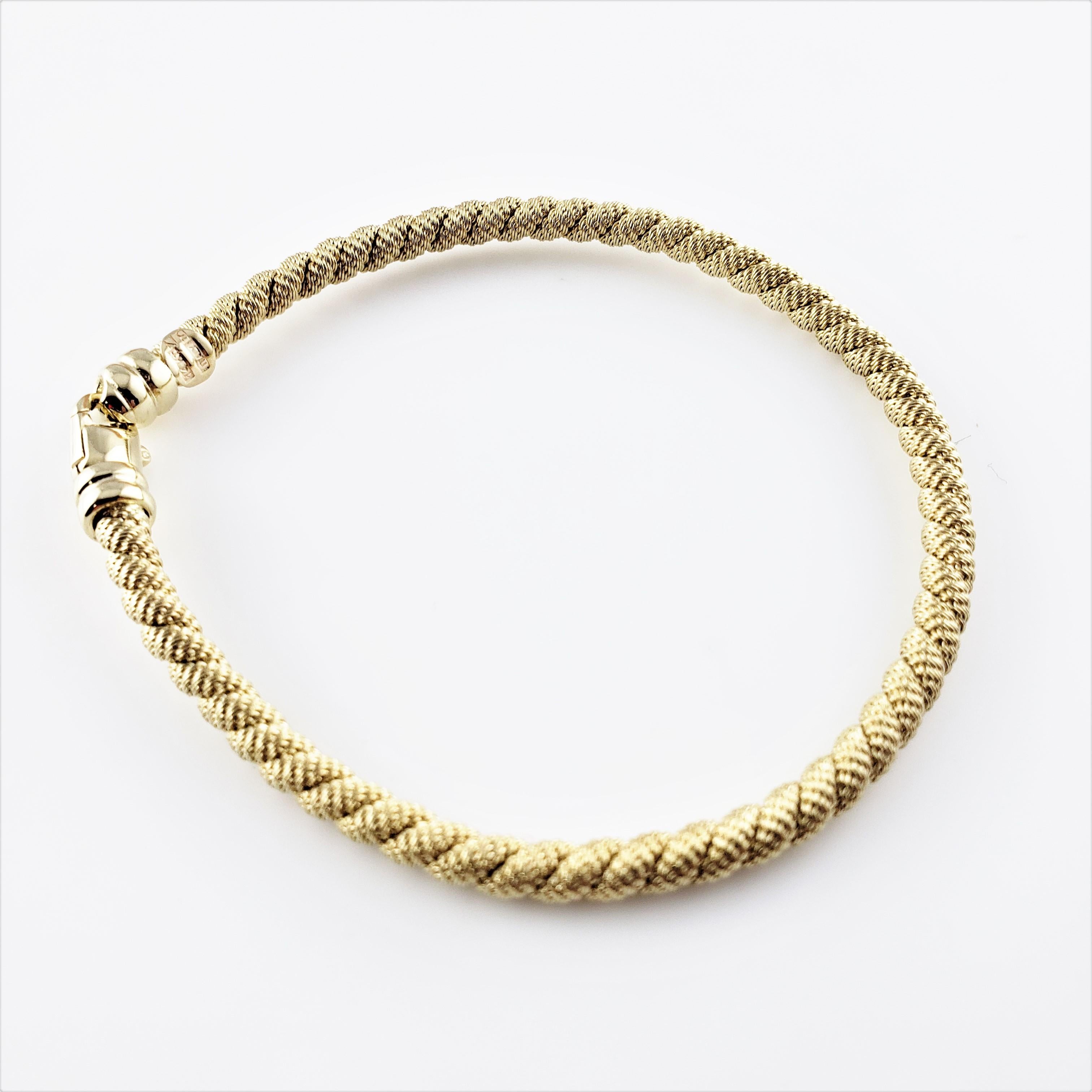 14 Karat Yellow Gold Cable Bracelet-

This elegant woven cable bracelet is crafted in beautifully detailed 14K yellow gold.  Width:  4 mm.

Size:  6.75 inches

Weight:  7.2 dwt. /  11.2 gr.

Stamped: 14K Italy BN

Very good condition, professionally