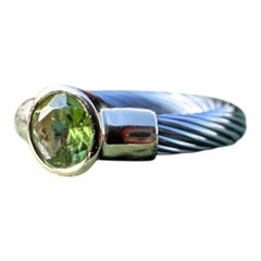 14 karat yellow gold cable ring with brilliant 1.00 carat, peridot gemstone.