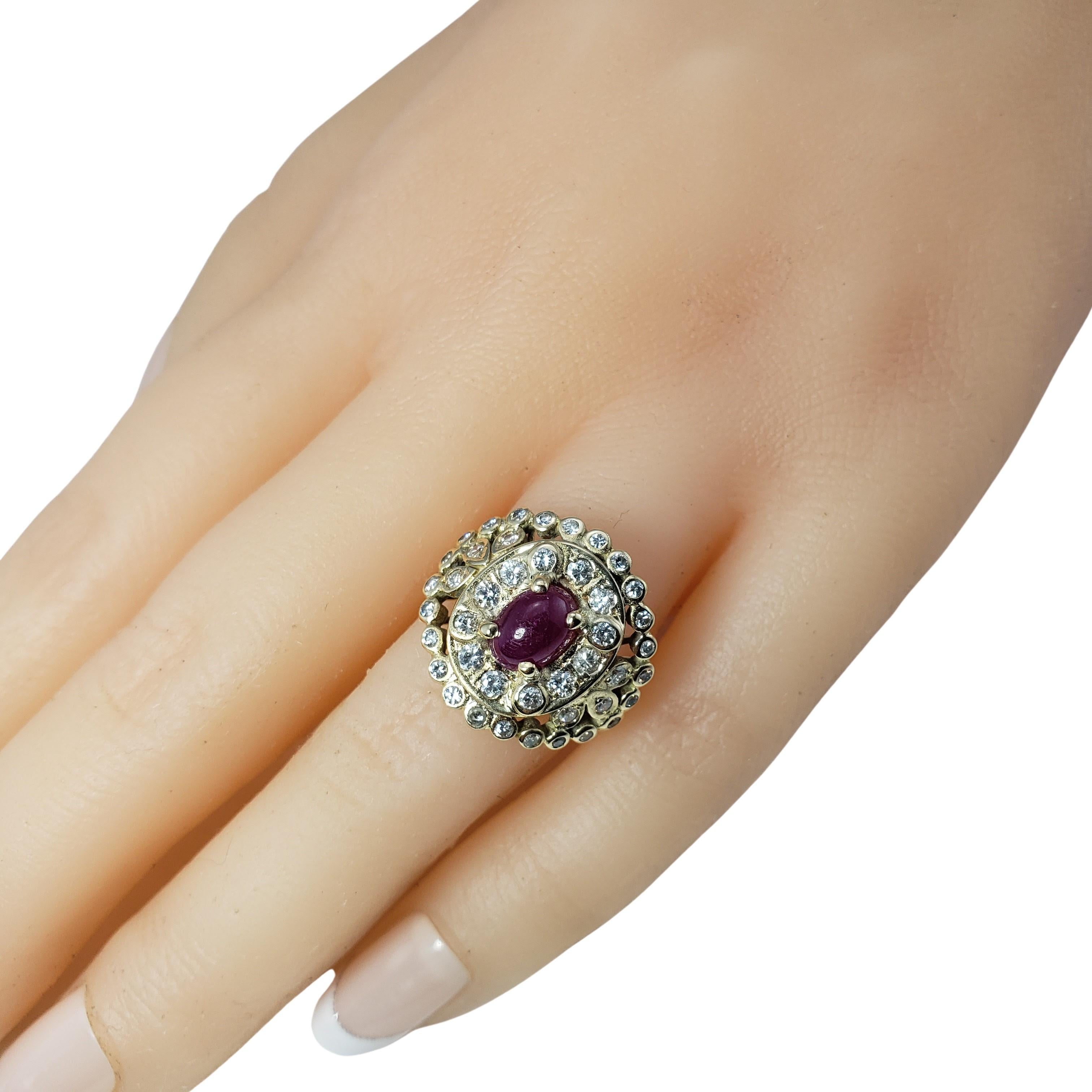 Vintage 14 Karat Yellow Gold Natural Cabochon Ruby and Diamond Ring Size 6.25-

This lovely ring features one oval cabochon ruby (7 mm x 5 mm) and 41 round brilliant cut diamonds set in beautifully detailed 14K yellow gold.  Width:  17 mm.  Shank: 