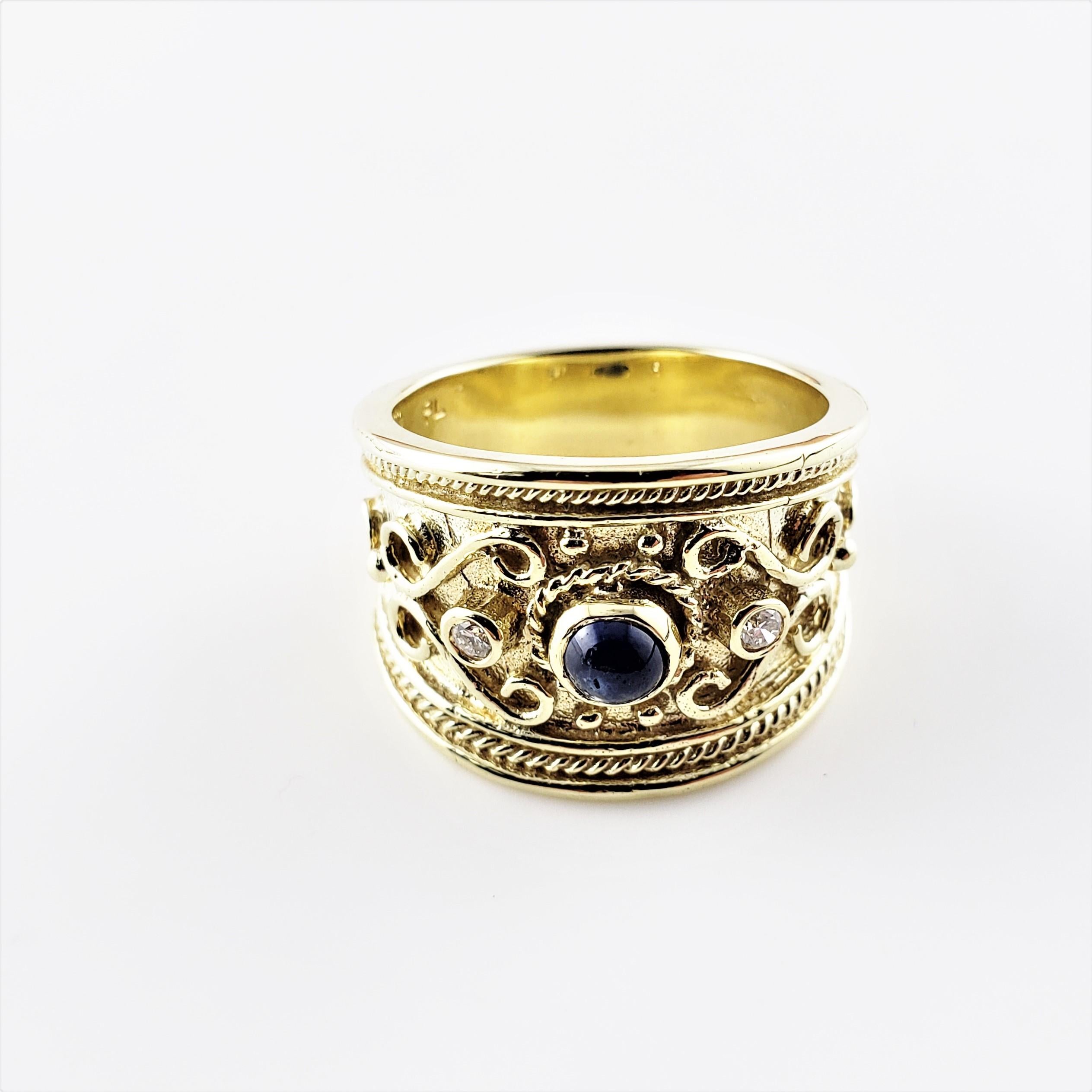 Vintage 14 Karat Yellow Gold Cabochon Sapphire and Diamond Band Ring Size 6.5-

This lovely band feature one cabochon sapphire (5 mm) and two round brilliant cut diamonds set in beautifully detailed 14K yellow gold. Width: 15 mm. Shank: 7