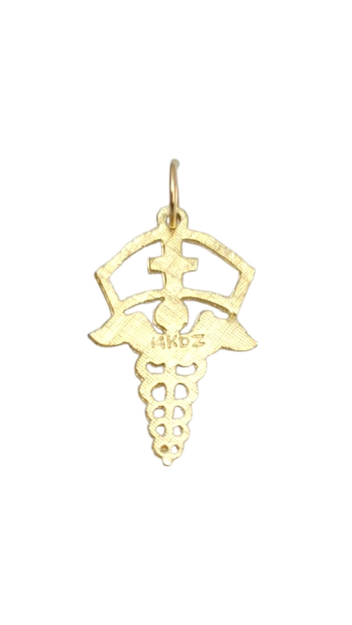 14 Karat Yellow Gold Caduceus Symbol of Medicine Charm

This meticulously detailed 14K yellow gold caduceus pendant is more than just jewelry—it's a tribute to compassion, care, and the art of healing.

Size: 23.1 mm X 14.5 mm X 1.0 mm

Weight: 0.9