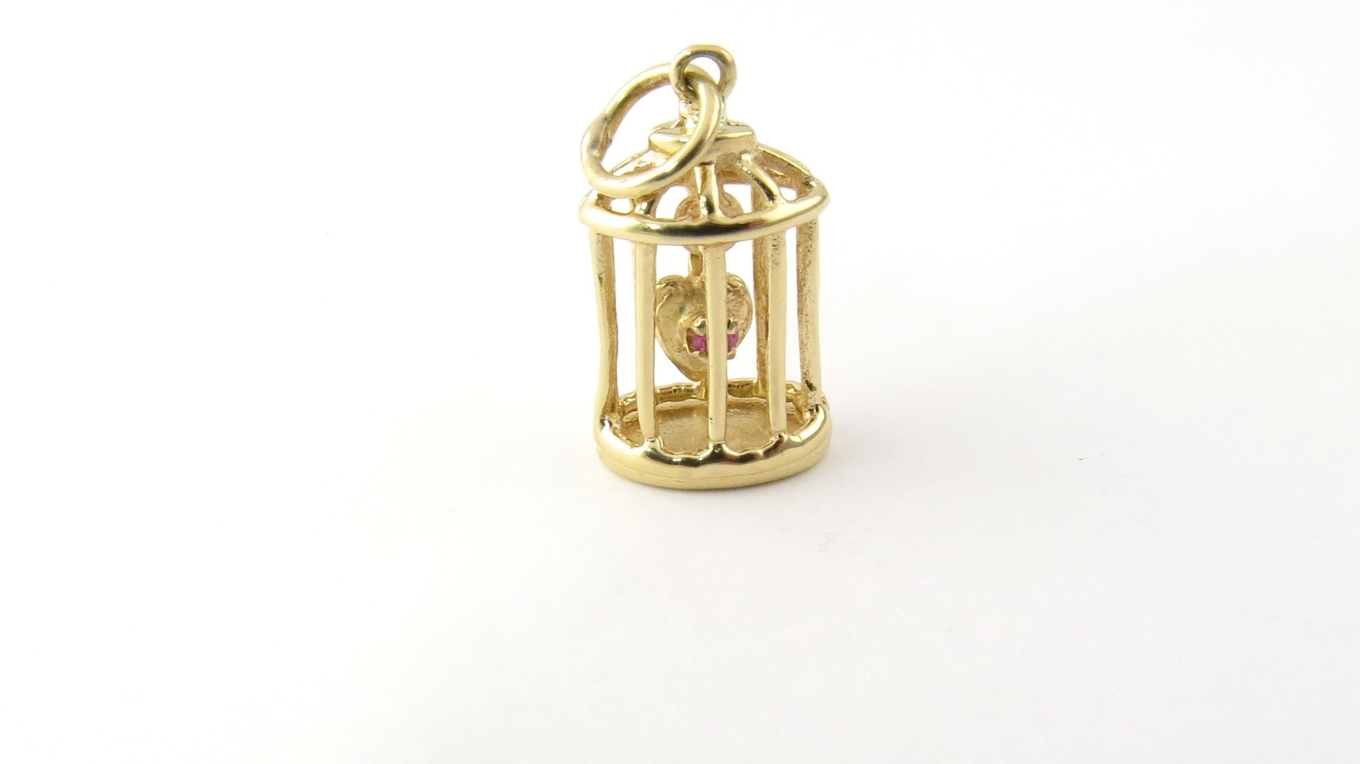 Vintage 14 Karat Yellow Gold Caged Heart Charm.

This delightful 3D charm features a miniature cage and dangling heart accented with a lovely red gemstone. Beautifully detailed in 14K yellow gold.

Size: 20 mm x 12 mm (actual charm)

Weight: 1.9
