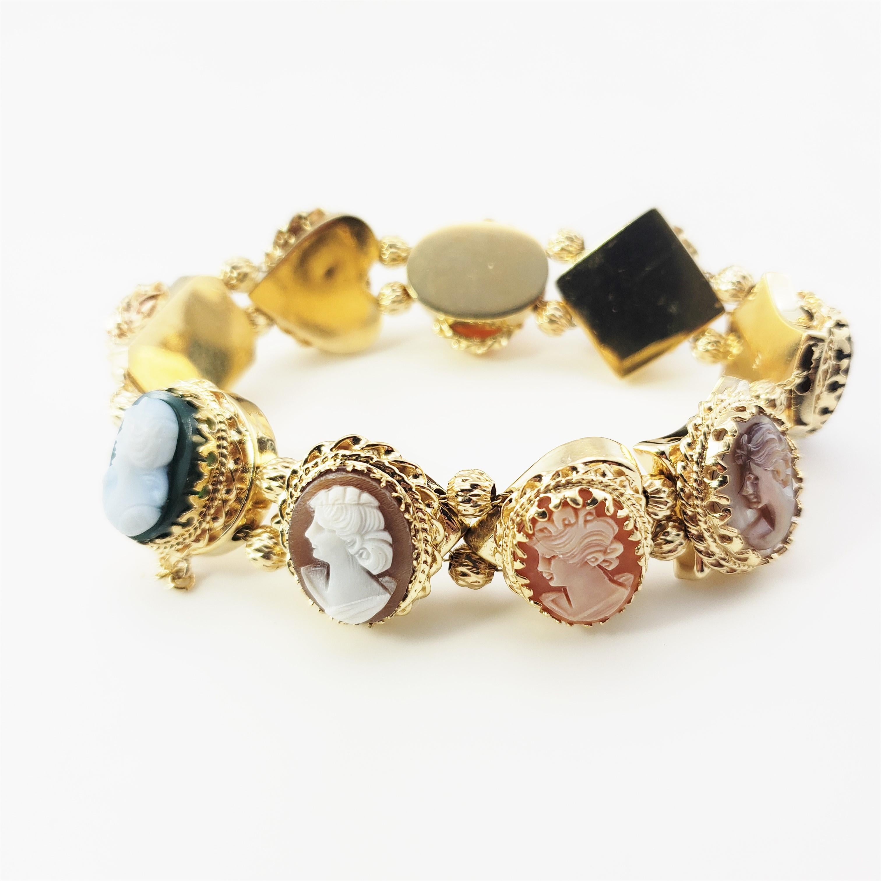 14 Karat Yellow Gold Cameo Bracelet-

This stunning bracelet features nine lovely cameos set in beautifully detailed 14K yellow gold.  Width:  20 mm.  Safety chain closure.

Size:  7.25 inches

Weight:  37.4 dwt. / 58.3 gr.

Stamped: 14K

Very good