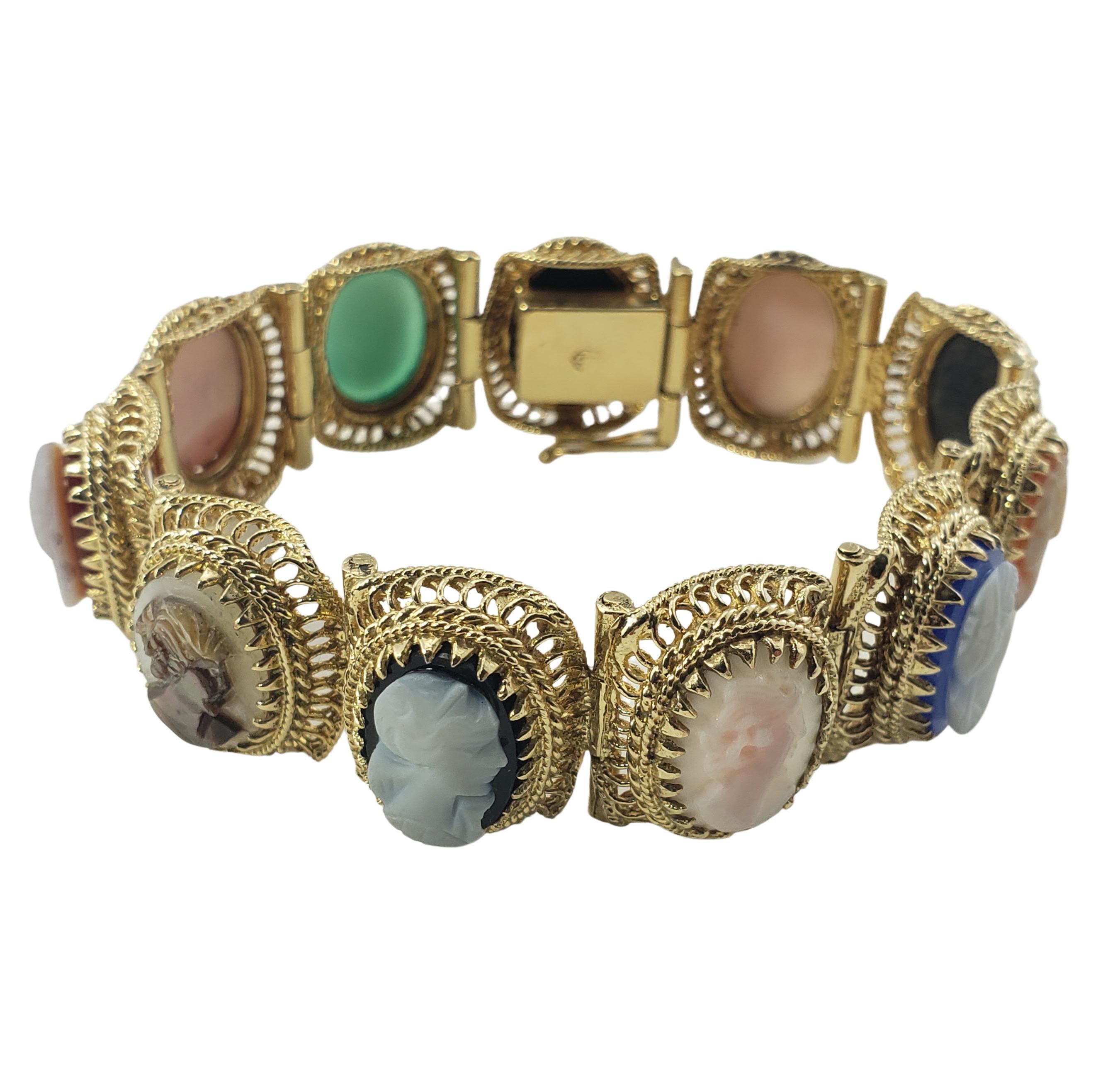 14 Karat Yellow Gold Cameo Bracelet-

This lovely bracelet features nine 11 multicolored cameos set in beautifully detailed 14K yellow gold.  Width:  17 mm.

Size:  6.25

Weight:  32.7 dwt. /  50.9 gr.

Tested for 14K gold.

Very good condition,