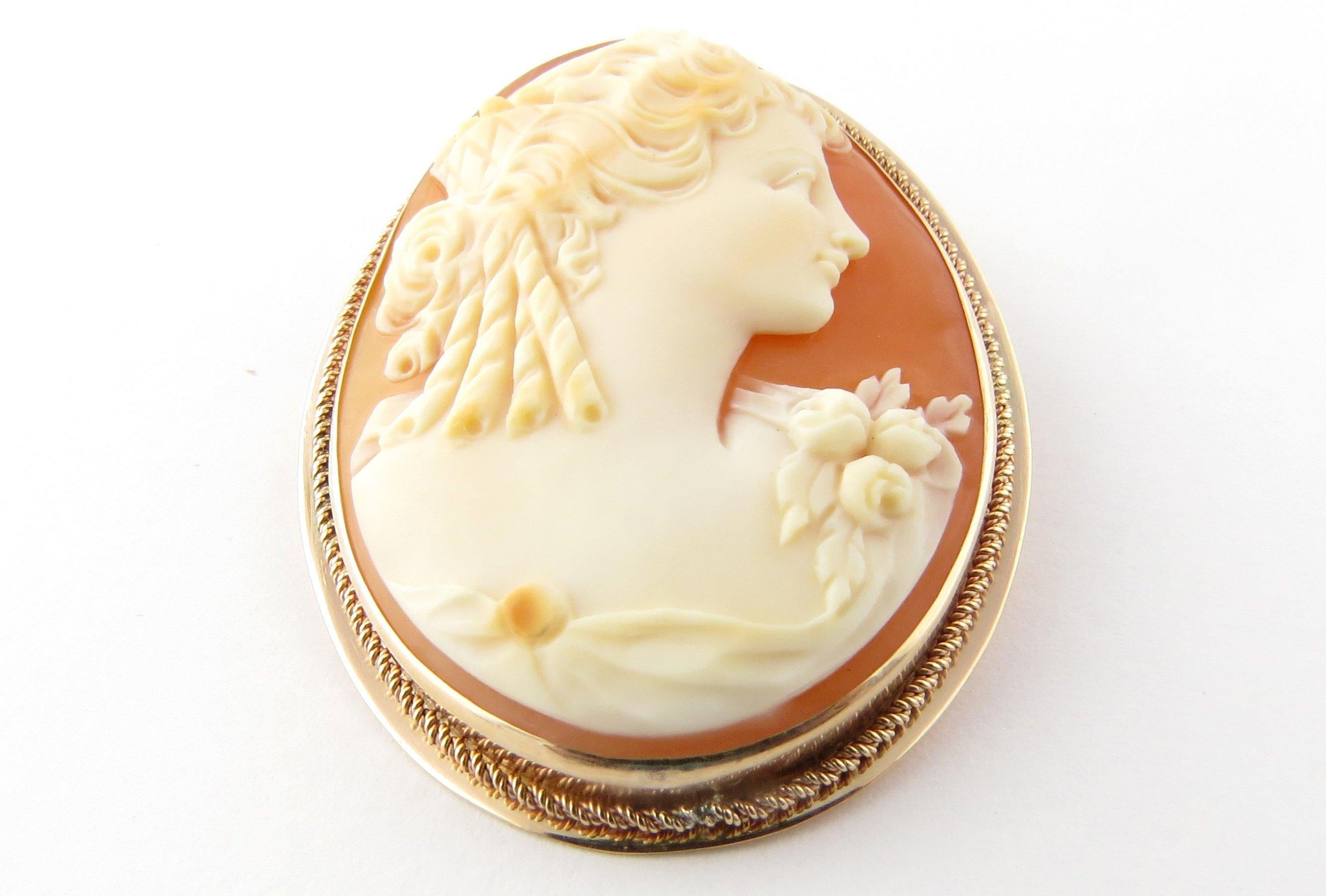 Vintage 14 Karat Yellow Gold Cameo Brooch/Pendant- 
This lovely cameo features a lovely lady in profile framed in beautifully detailed 14K yellow gold. Can be worn as a brooch or a pendant. 
Size: 44 mm x 34 mm 
Weight: 7.4 dwt. / 11.6 gr.