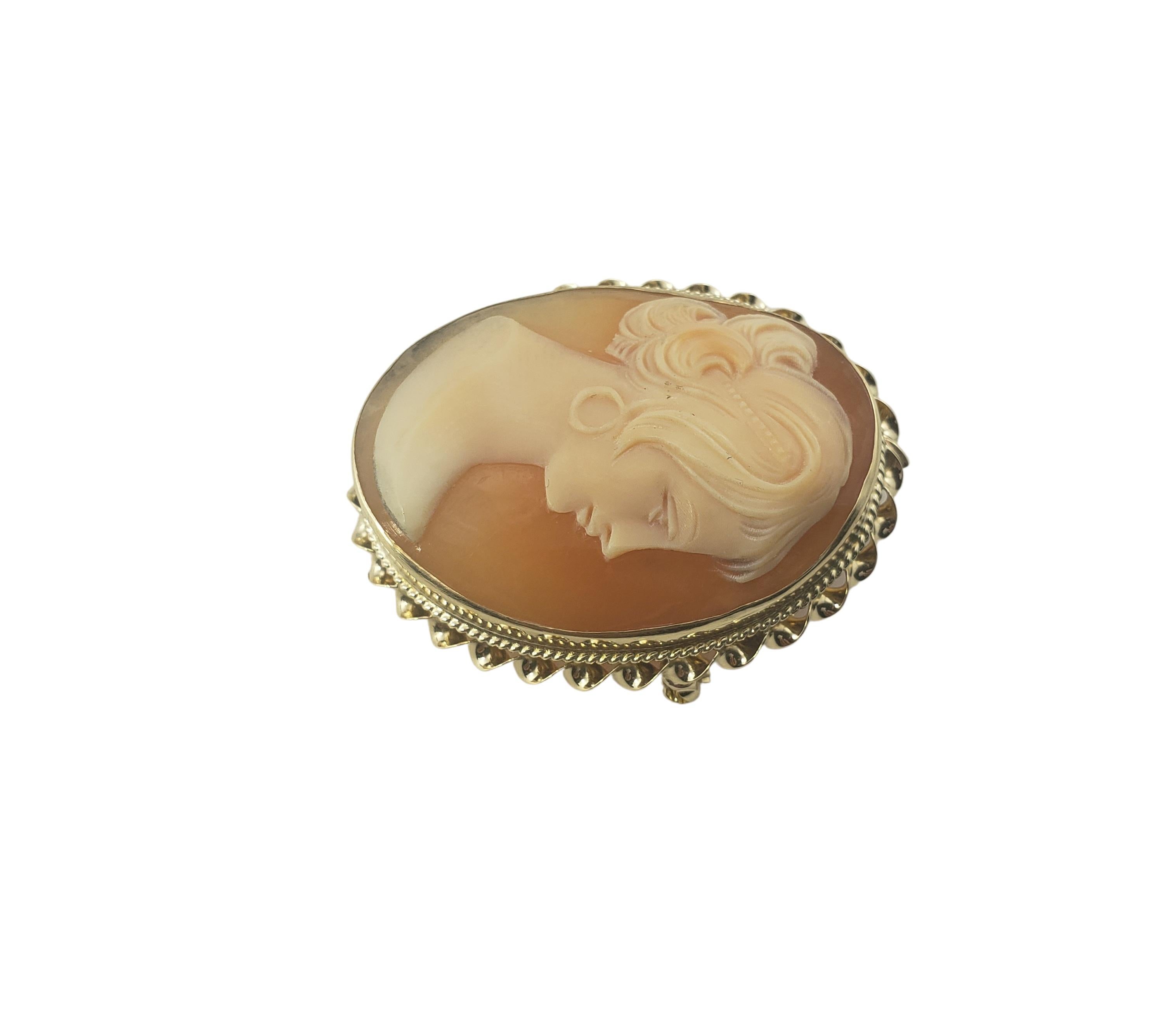 14 Karat Yellow Gold Cameo Brooch/Pendant-

This lovely cameo features a lovely lady in profile set beautifully detailed 14K yellow gold.  Can be worn as a brooch or a pendant.

Size:  29 mm x 20 mm

Weight:   4.5 dwt. /   7.1 gr.

Stamped: