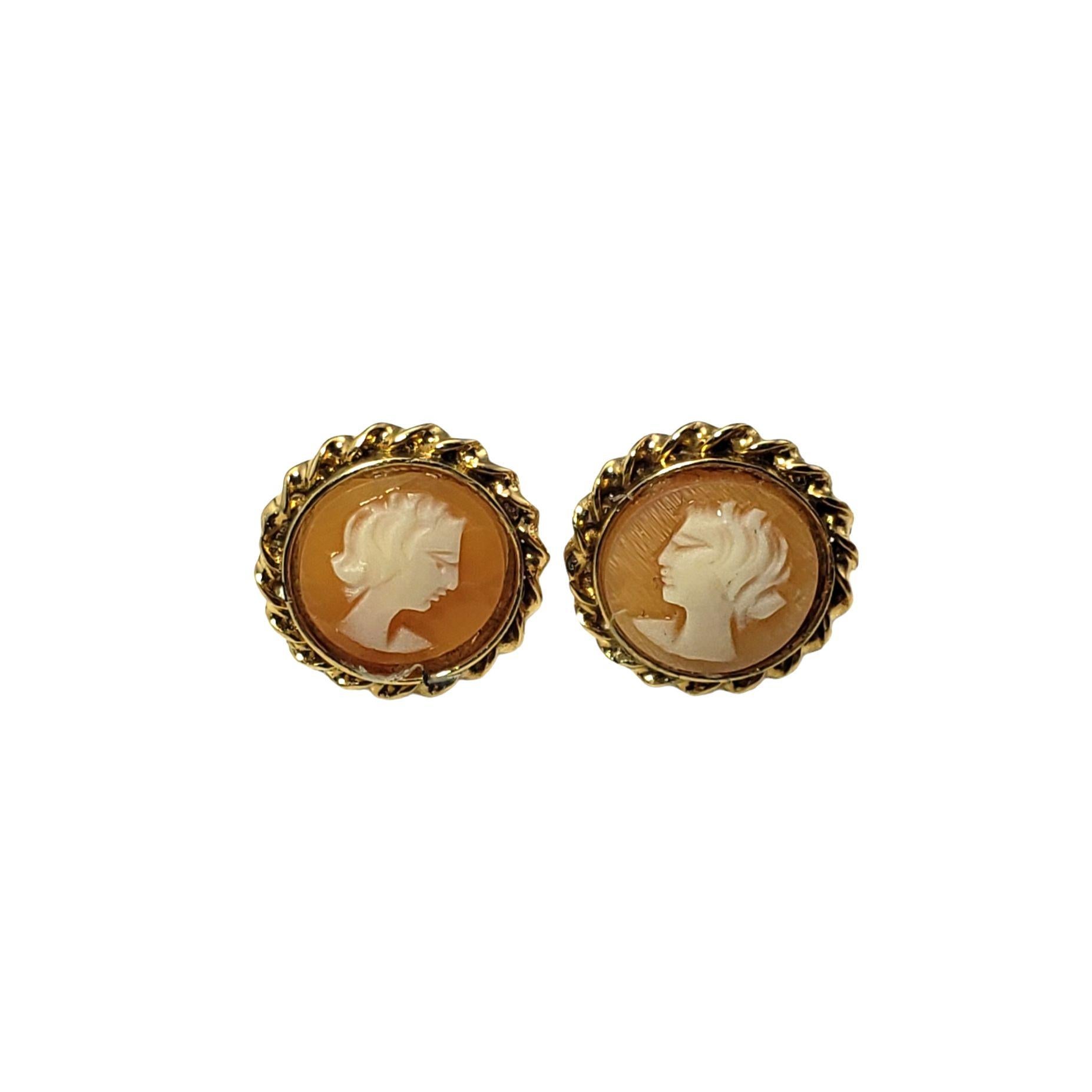 These elegant cameo earrings each feature a lovely lady in profile framed in 14K yellow gold.  Push back closures.

Size: 11 mm

Weight:  1.2 dwt. /  1.9 gr.

Tested 14K gold.

Very good condition, professionally polished.

Will come packaged in a