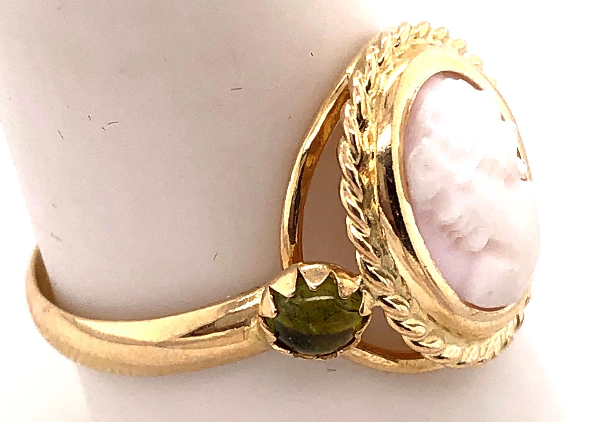 14 Karat Yellow Gold Cameo Ring with Stones .
Size 9
4 grams total weight