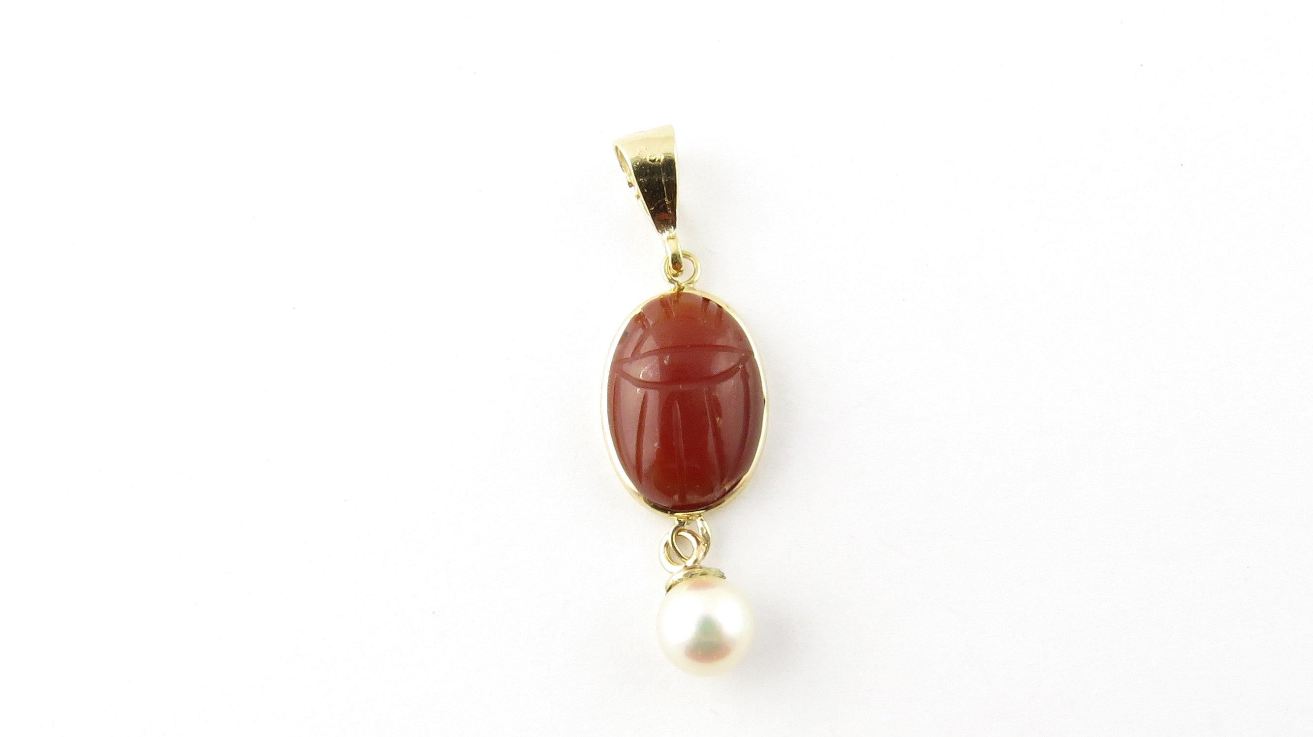 Vintage 14 Karat Yellow Gold Carrnelian Scarab and Pearl Pendant- 
This lovely pendant features a carrnelian scarab (14 mm x 11 mm) set in beautifully detailed 14K yellow gold accented with a dangling 6 mm white pearl. 
Size: 26 mm x 11 mm 
Weight: