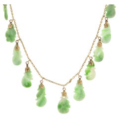 14 Karat Yellow Gold Carved Jade Drop Necklace