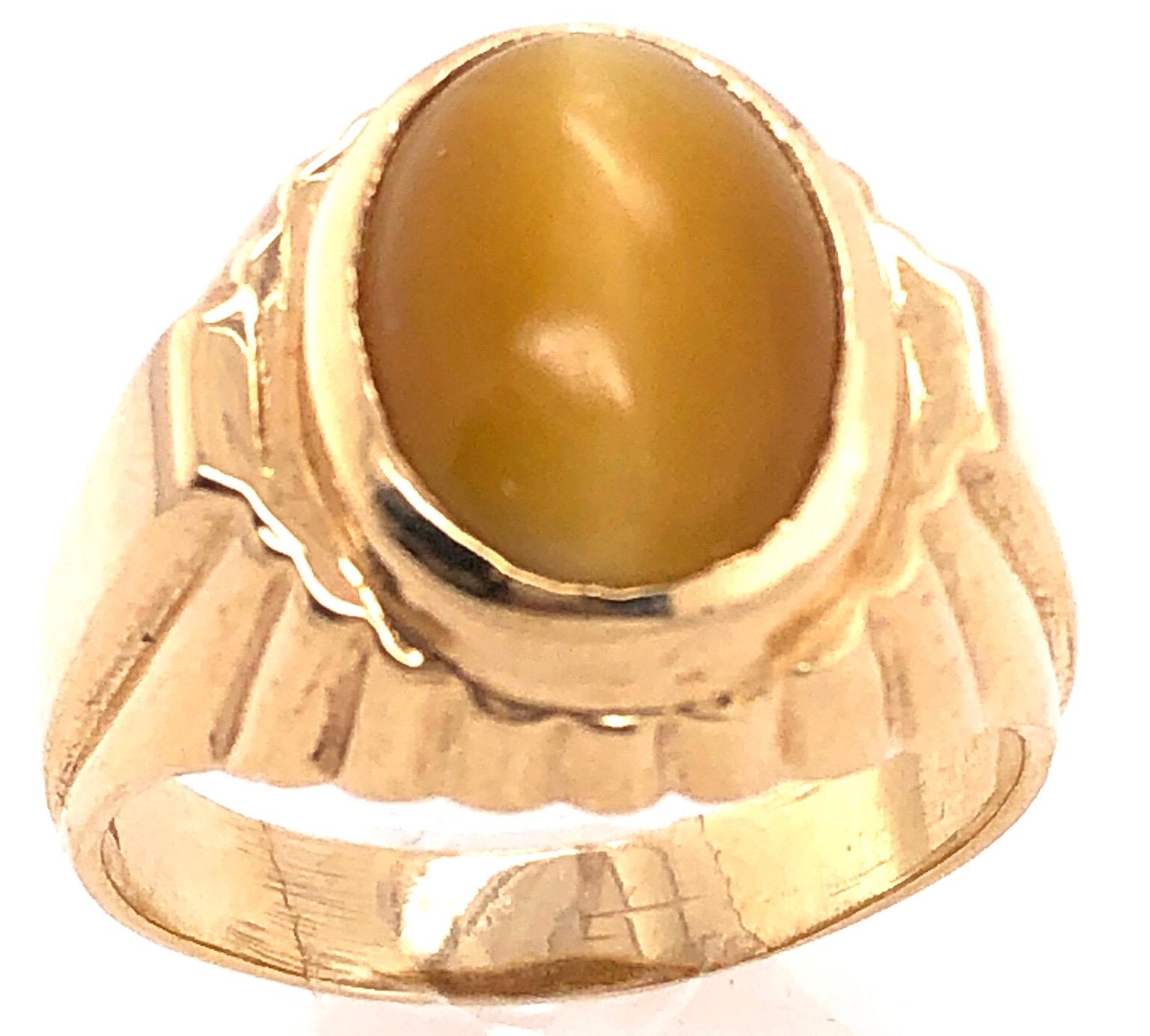 Oval Cut 14 Karat Yellow Gold Cat's Eye Contemporary Ring For Sale
