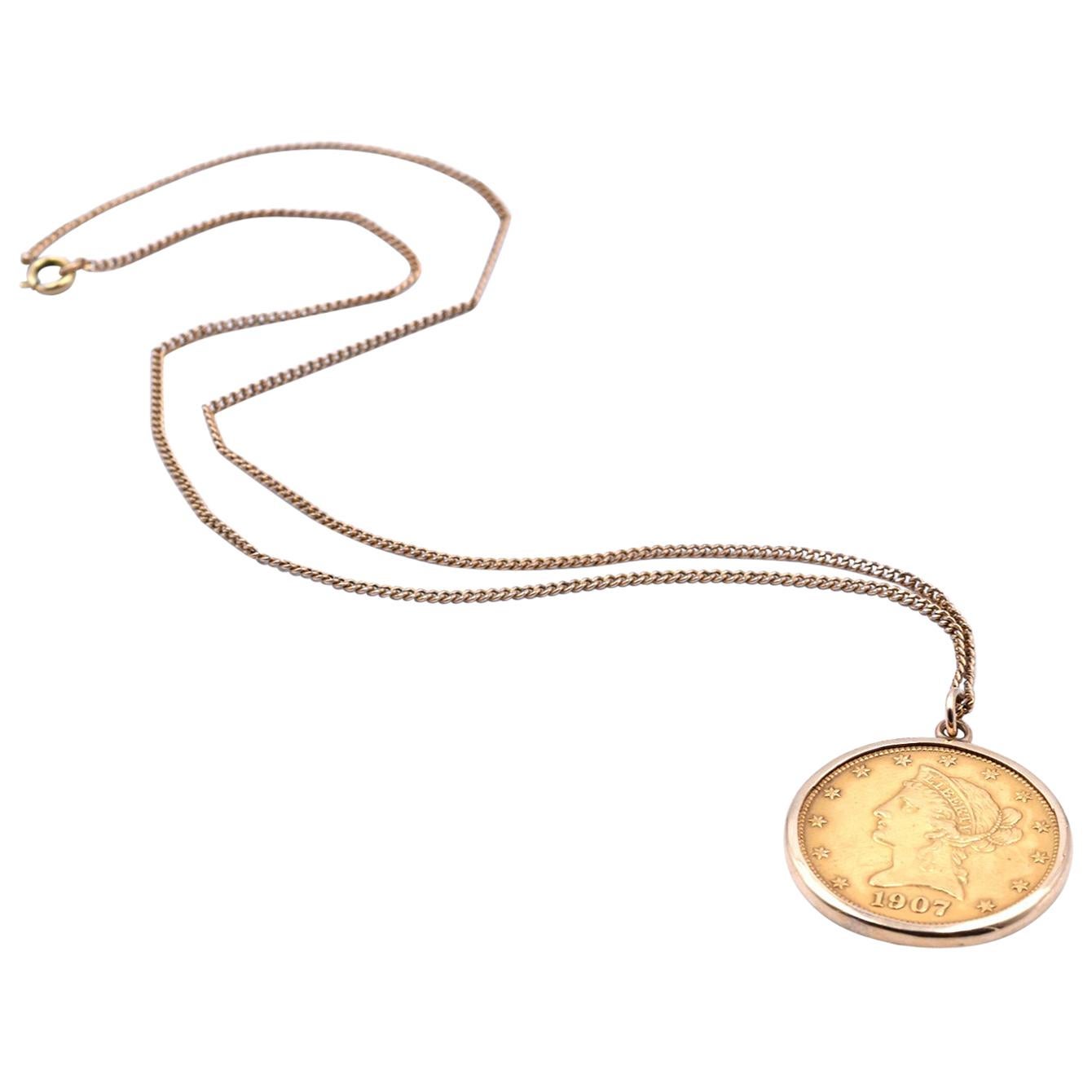 14 Karat Yellow Gold Chain and Liberty Coin Pendant