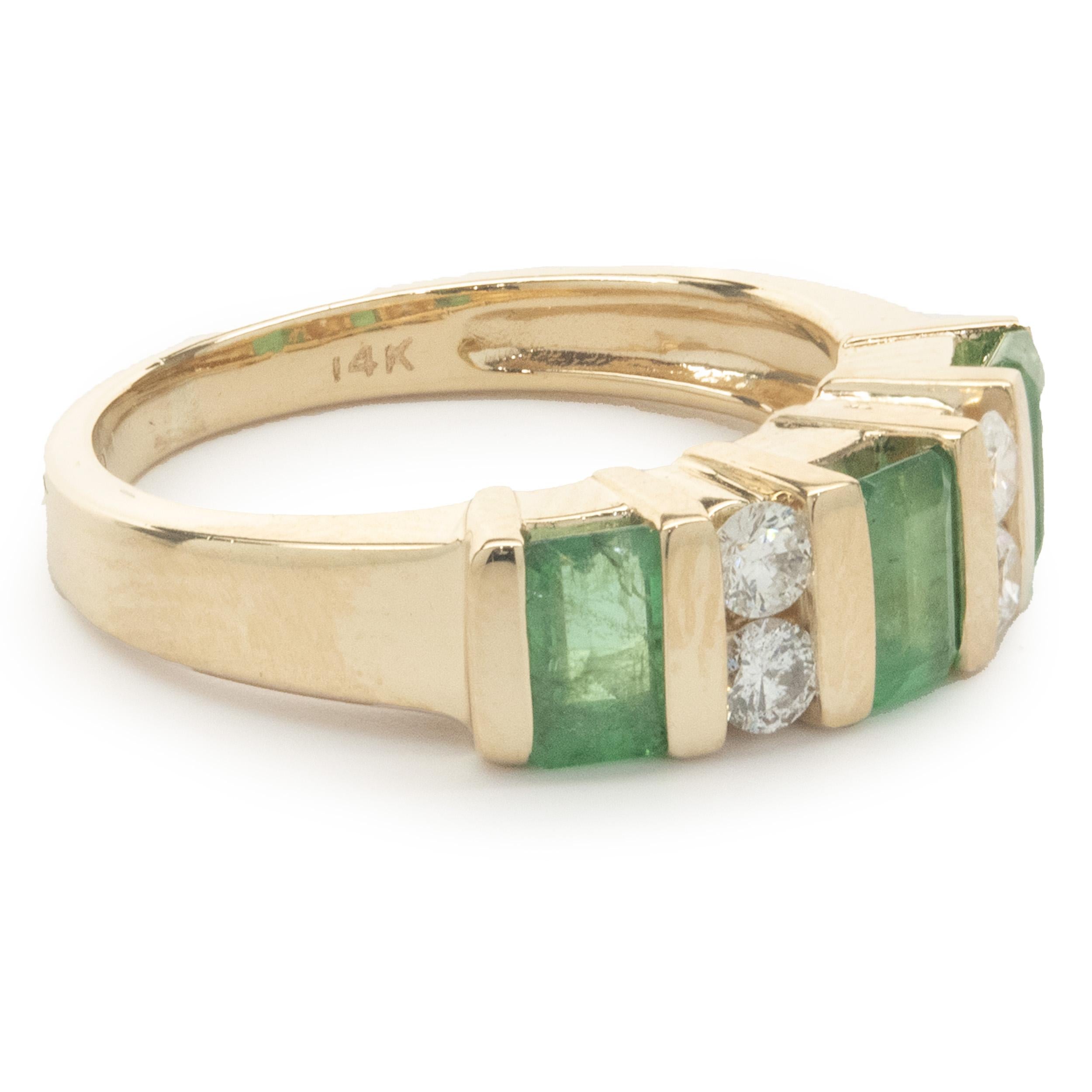 Designer: custom
Material: 14K yellow gold
Diamond: 4 round brilliant cut = 0.16cttw
Color: G
Clarity: SI1
Emerald: 3 baguette cut = 0.60cttw
Dimensions: ring top measures 5.4mm wide
Ring Size: 5 (complimentary sizing available)
Weight: 4.56 grams