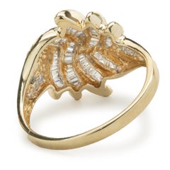 14 Karat Yellow Gold Channel Set Baguette Cut Diamond Swirl Ring