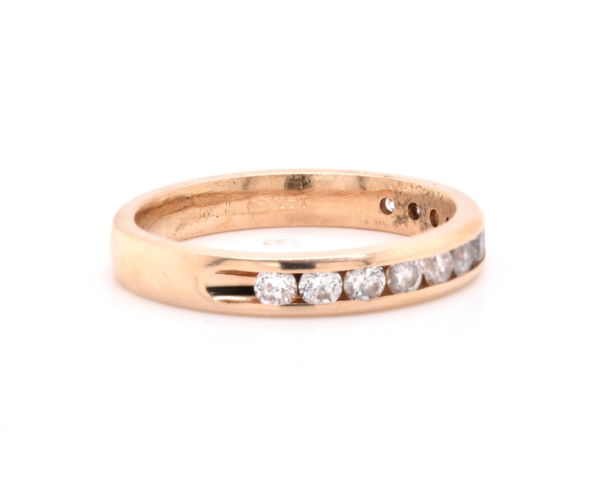 Designer: custom
Material: 14K yellow gold
Diamonds: 12 round cut = .60cttw
Color: H
Clarity: SI1
Size: 5.5 (please allow two additional shipping days for sizing requests)  
Dimensions: ring measures 3mm in width
Weight: 2.79 grams