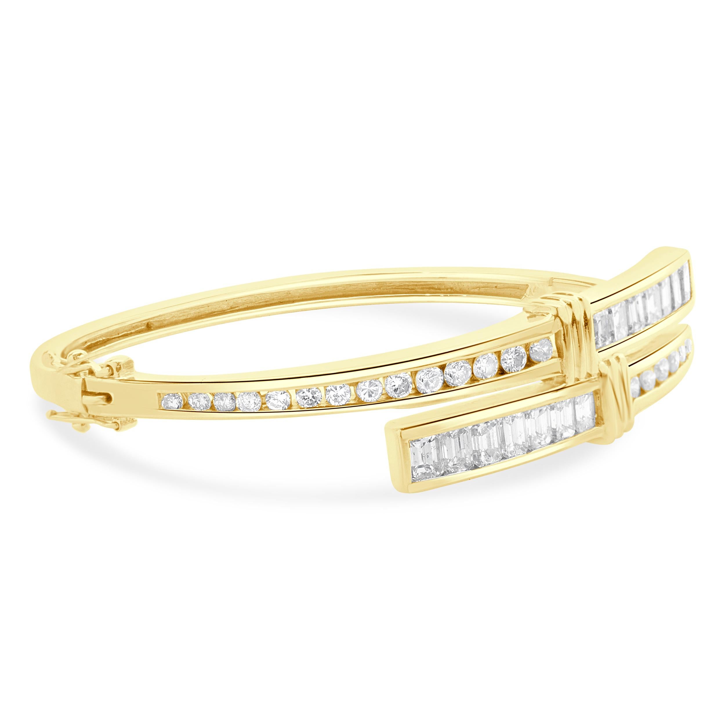 Designer: custom design
Material: 14K yellow gold
Diamond: 42 round brilliant cut = 2.10cttw
Color: H
Clarity: SI1
Dimensions: bracelet will fit up to a 6.5-inch wrist
Weight: 20.70 grams
