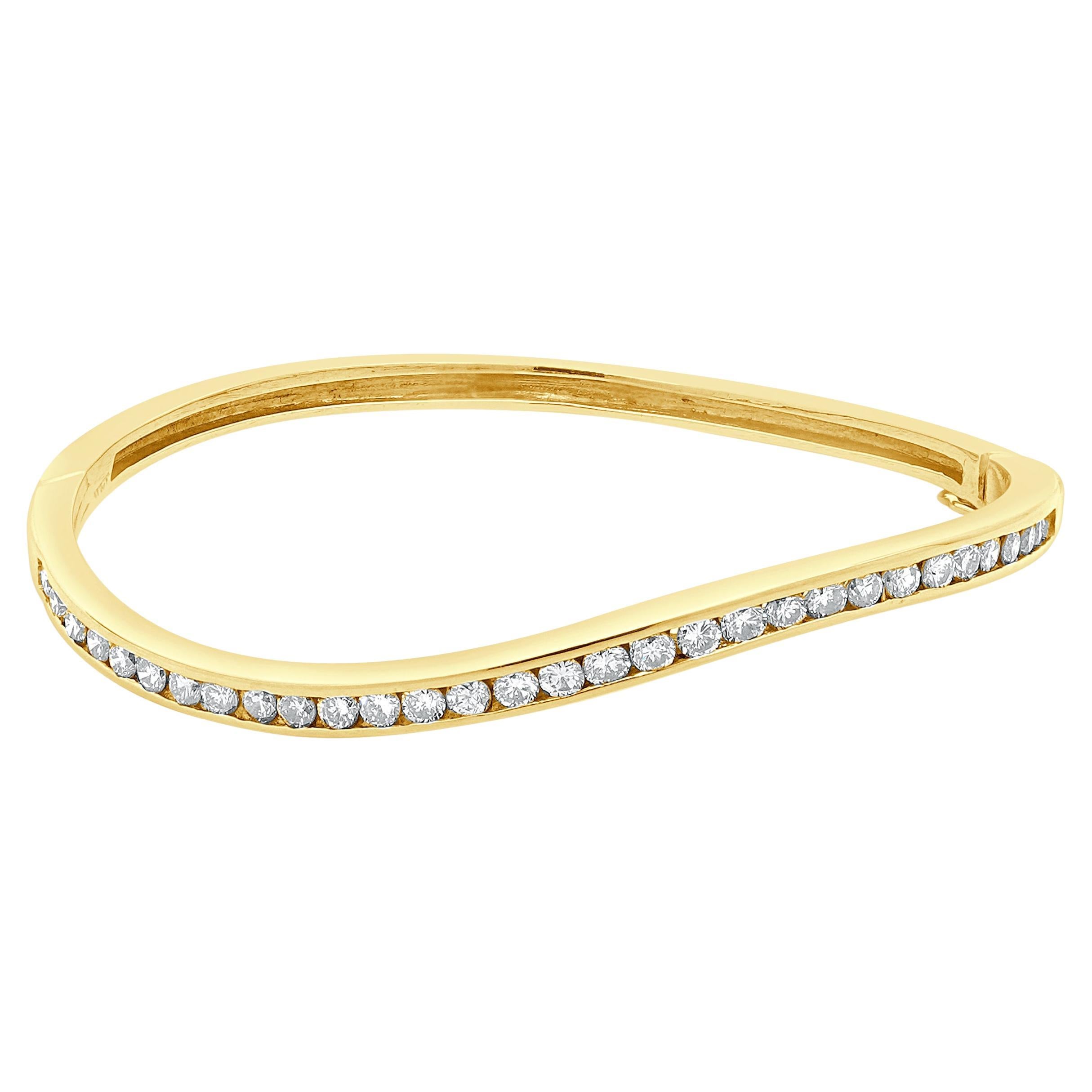 Bracciale a onde con diamanti incastonati in oro giallo 14 carati