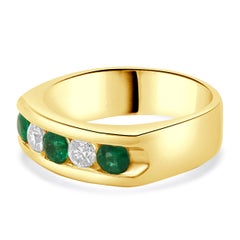 14 Karat Yellow Gold Channel Set Emerald and Diamond Ring