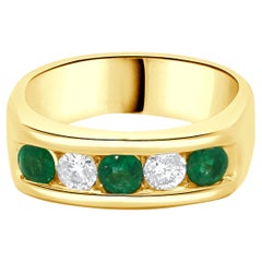 14 Karat Yellow Gold Channel Set Emerald and Diamond Ring