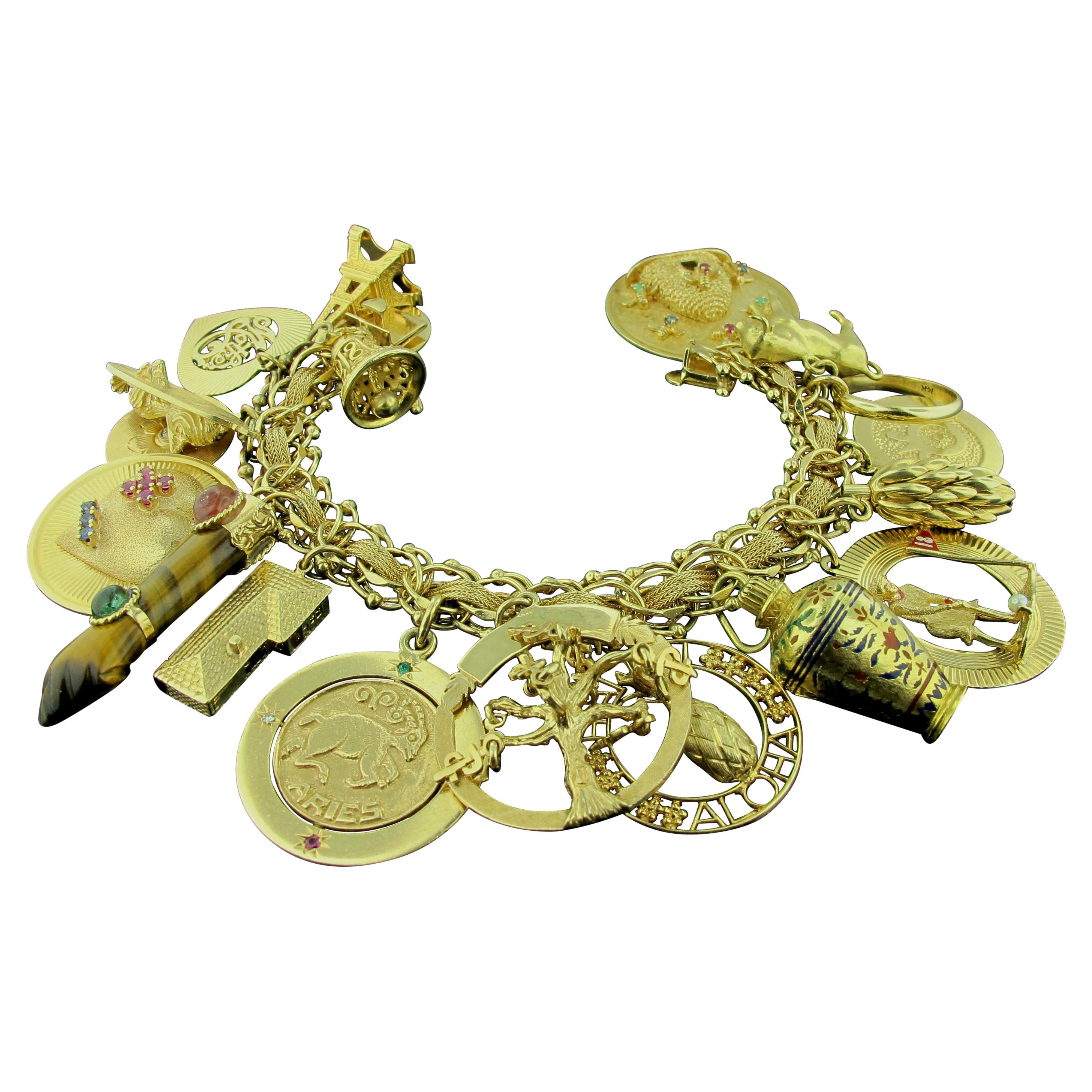 14 Karat Yellow Gold Charm Bracelet with 19 Charms